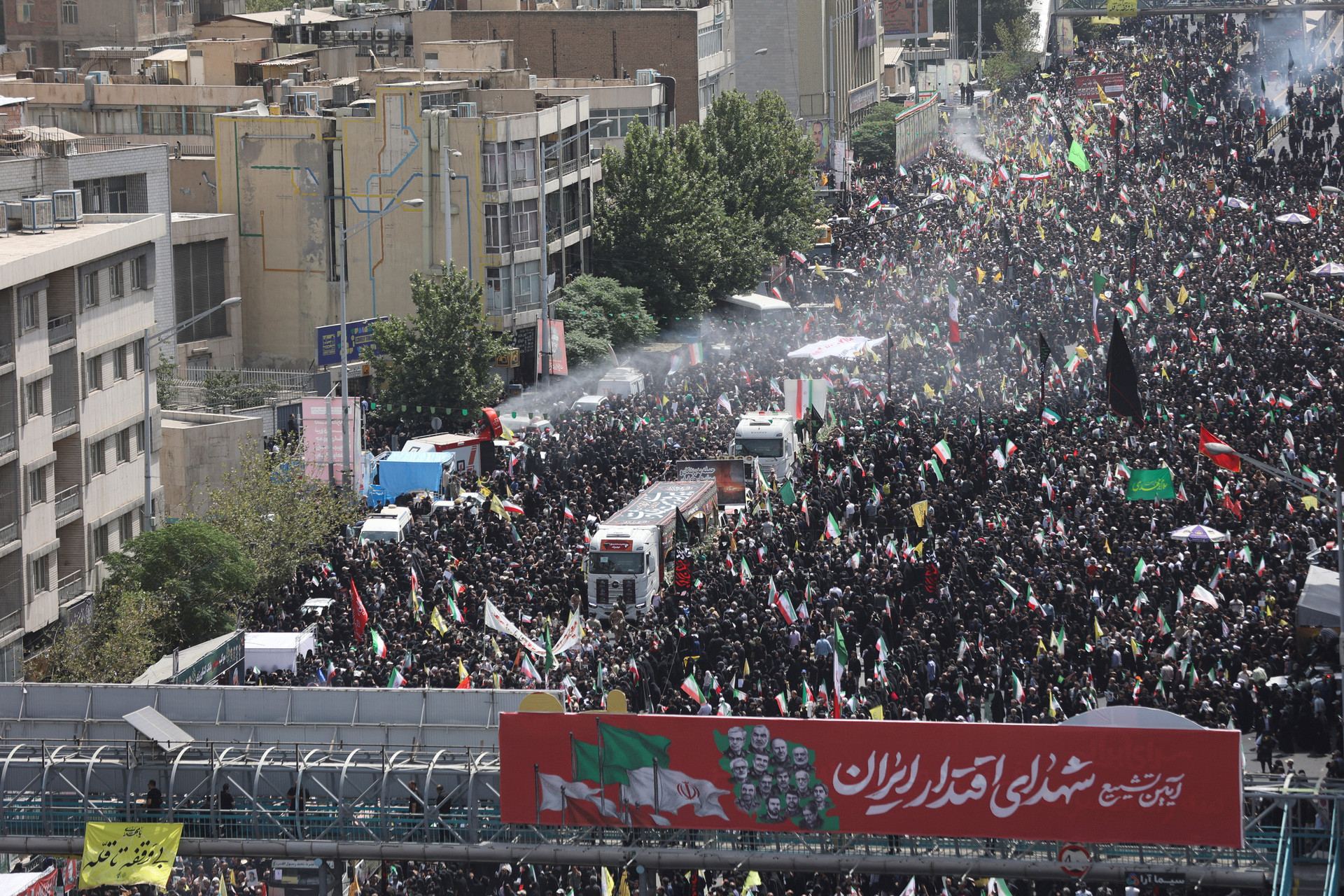 The procession to honour the dead will continue for miles through central Tehran to Azadi Square (Reuters)