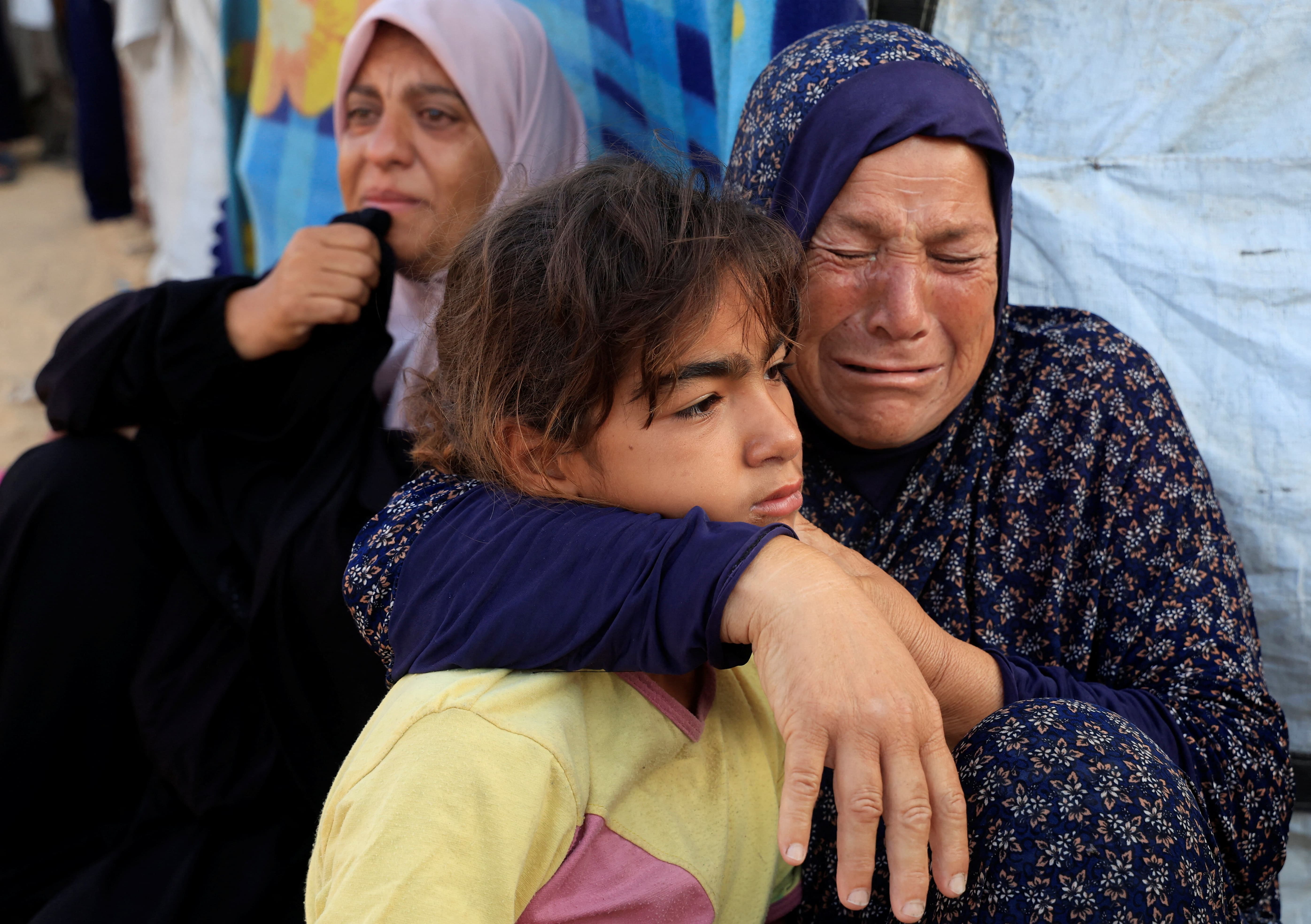 Mourners react during the funeral of Palestinians, who, according to Gaza's health ministry, were killed in an overnight Israeli strike on a tent, at Nasser Hospital in Khan Younis, southern Gaza Strip, July 2, 2025. REUTERS/Hatem Khaled TPX IMAGES OF THE DAY