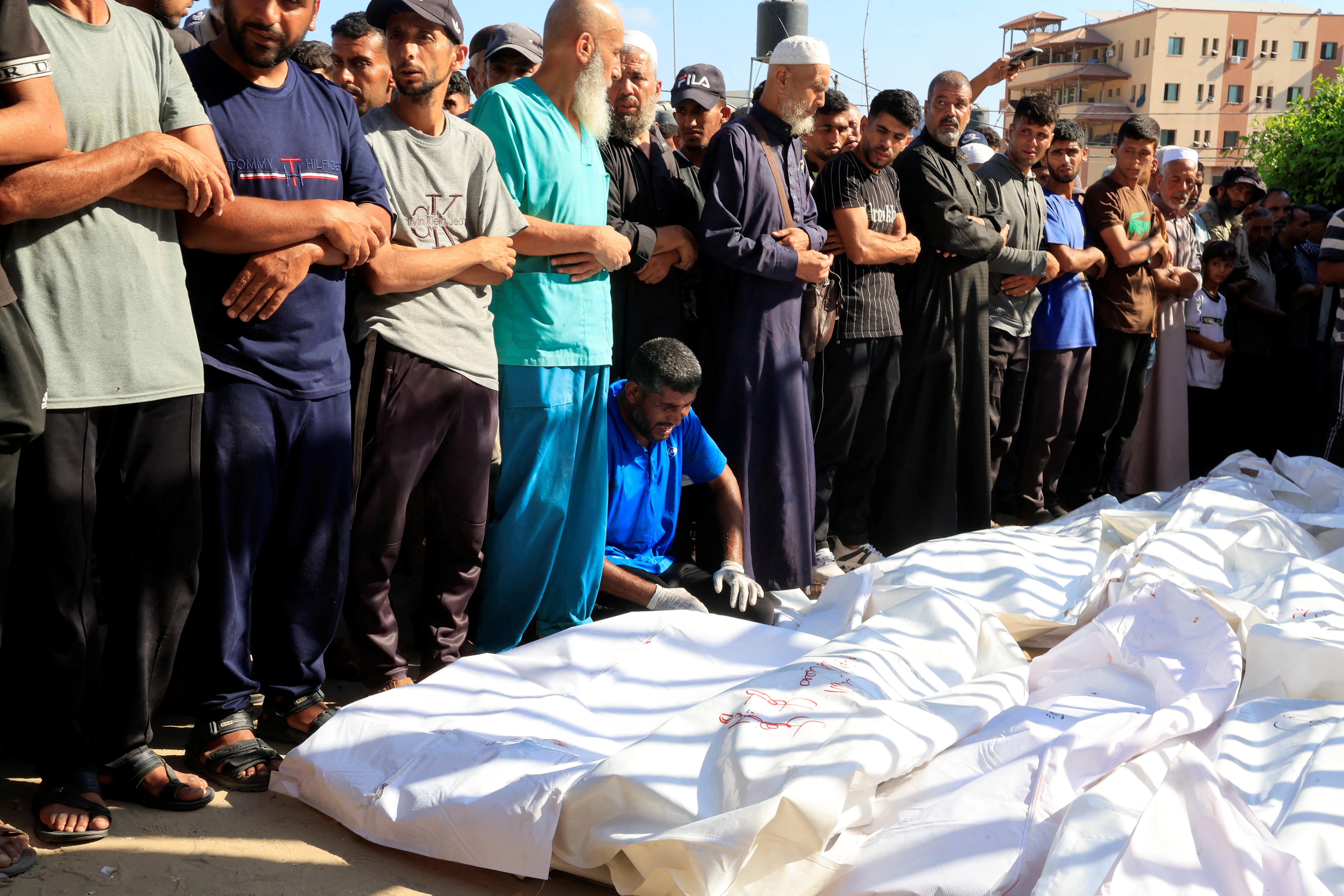 Mourners pray during the funeral of Palestinians, who, according to Gaza's health ministry, were killed in an overnight Israeli strike on a tent, at Nasser Hospital in Khan Younis, southern Gaza Strip, July 3, 2025.