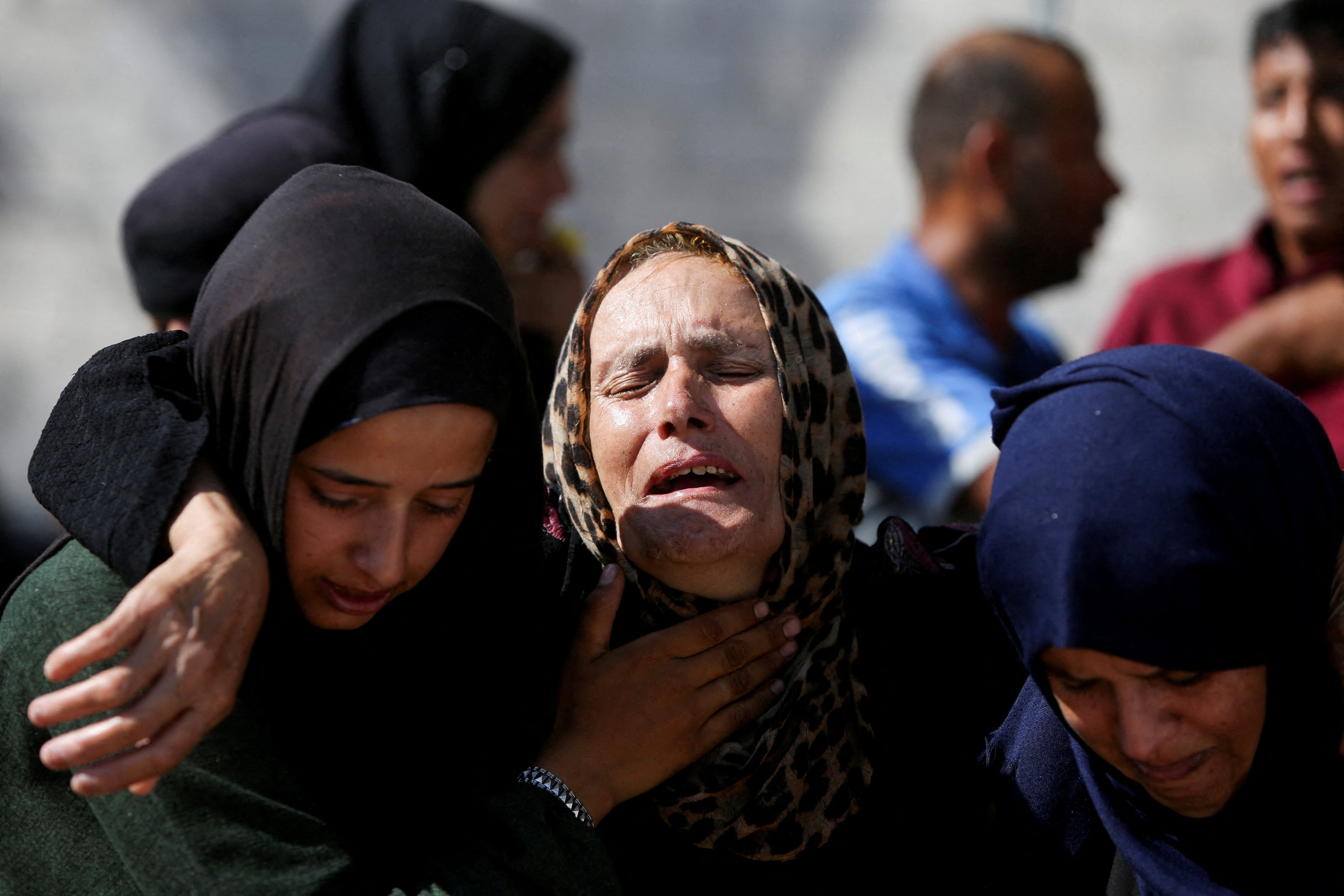 Mourners react during the funeral of Palestinians, who, according to Gaza's health ministry, were killed in an overnight Israeli strike on a tent, at Nasser Hospital in Khan Younis, southern Gaza Strip, July 3, 2025. REUTERS