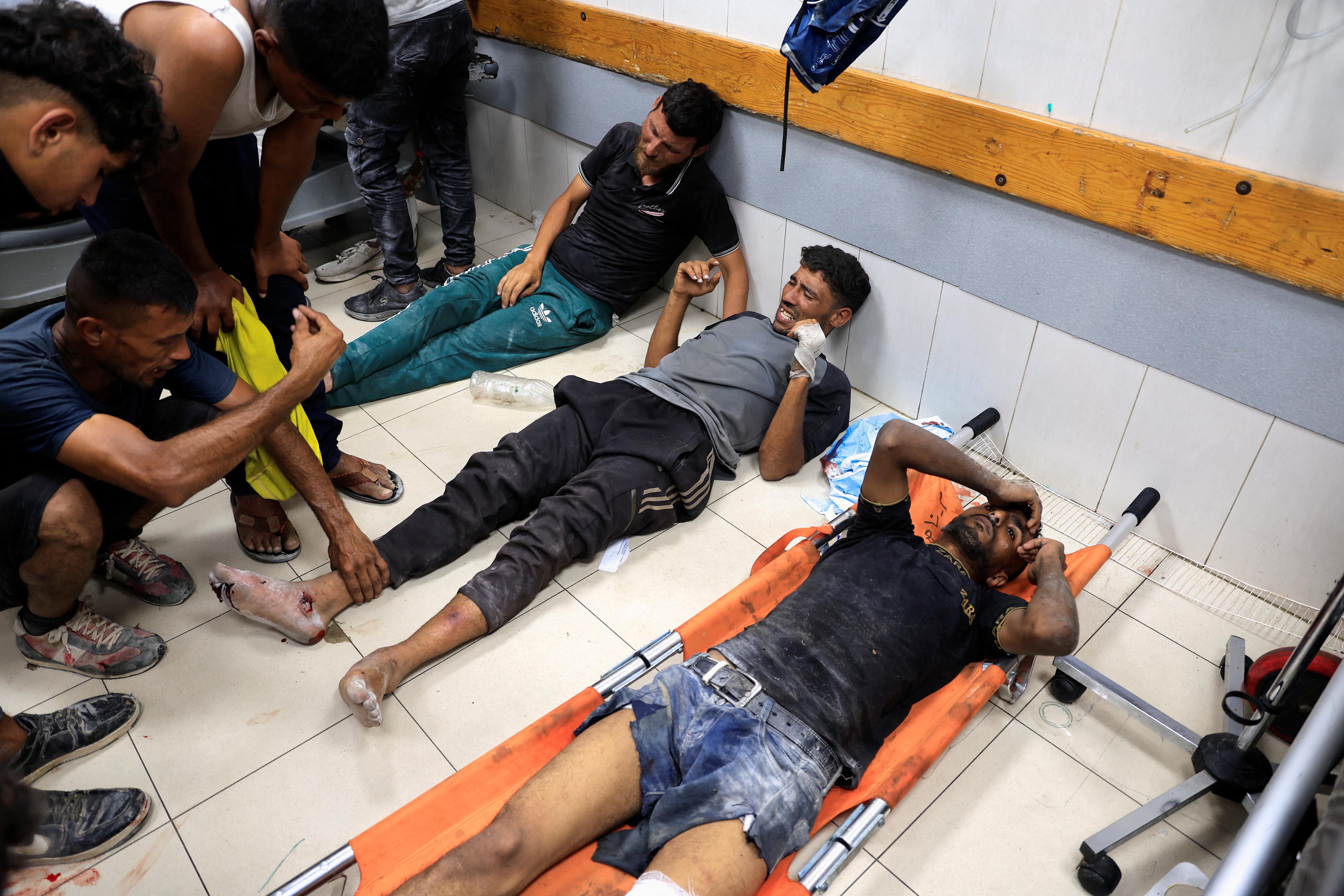 Palestinians, wounded by Israeli fire while seeking aid, according to medics, are assisted at Nasser Hospital in Khan Younis, southern Gaza Strip, July 3, 2025. REUTERS