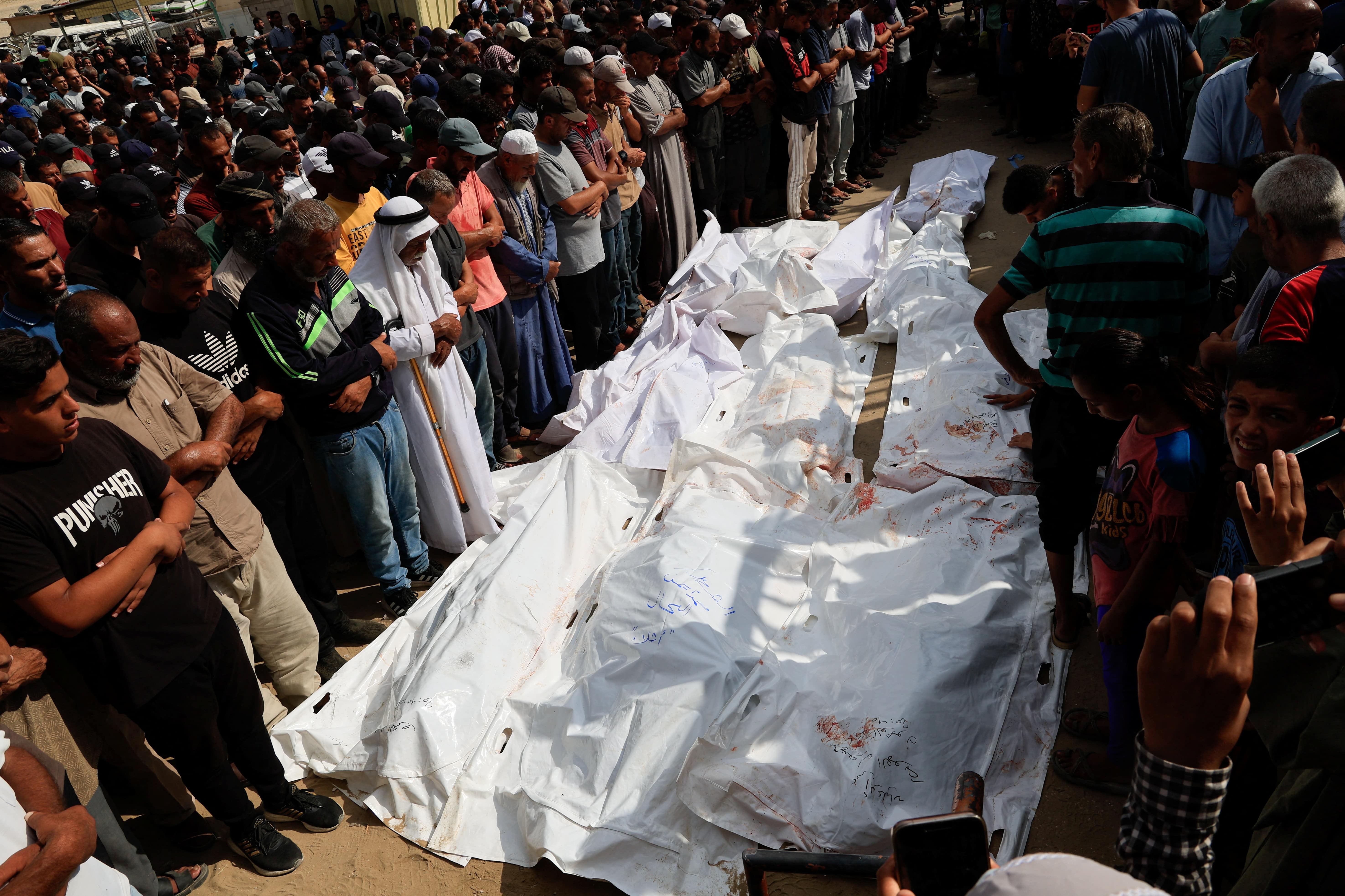 Mourners pray during the funeral of Palestinians killed overnight in Israeli attacks on a tent and on people seeking aid, according to Gaza's health ministry, at Nasser Hospital in Khan Younis, southern Gaza Strip, July 4, 2025. REUTERS