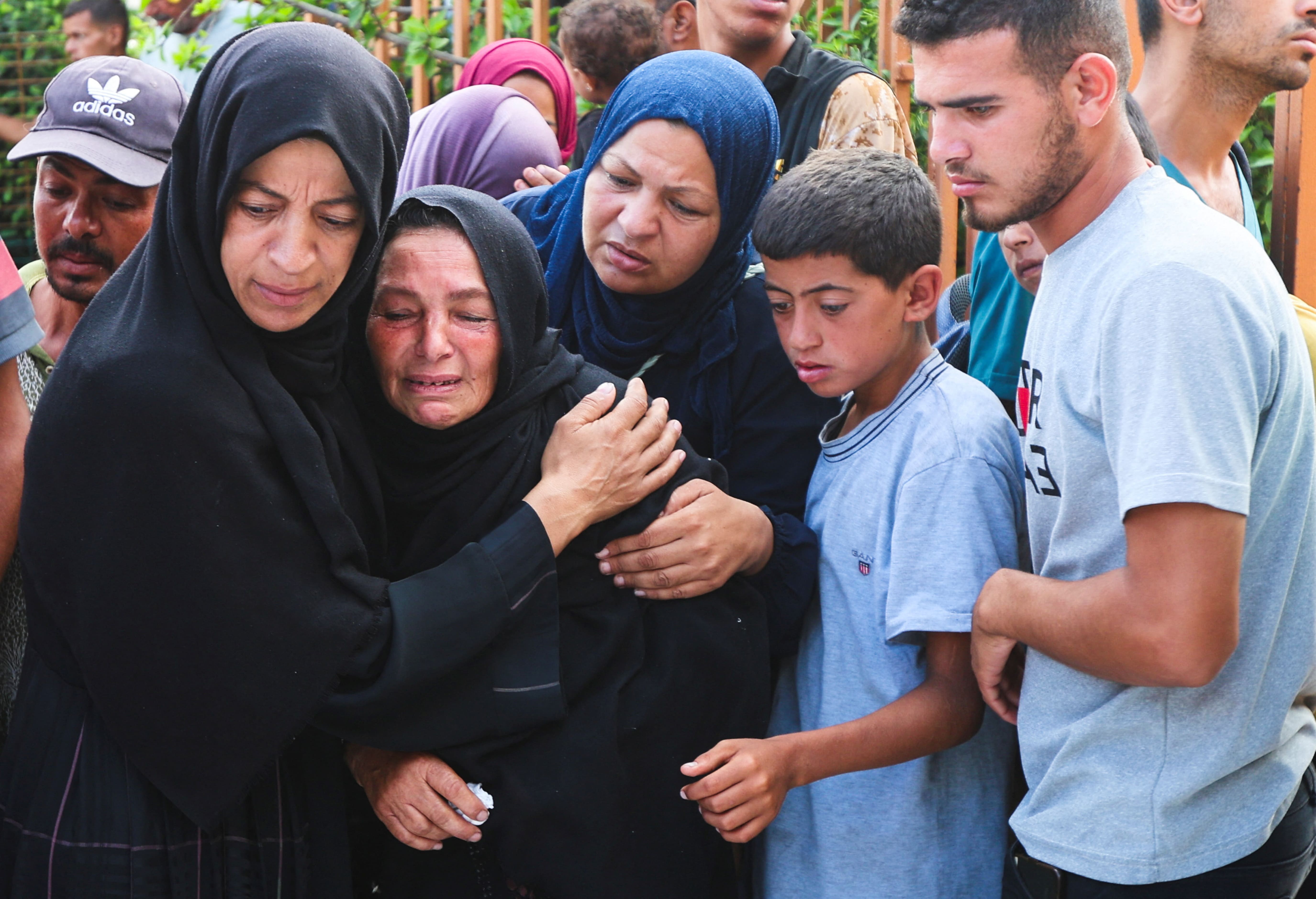 Mourners react during the funeral of Palestinians killed in overnight Israeli strikes, according to medics, at Nasser Hospital in Khan Younis, southern Gaza Strip, 12 July, 2025. (Reuters)