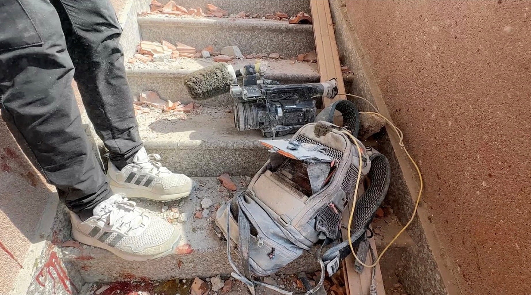 Equipment used by Palestinian cameraman Hussam al-Masri, who was a contractor for Reuters, lies at the site where he was killed, along with other journalists and people, in Israeli strikes on Nasser hospital, in Khan Younis in the southern Gaza Strip, in this still image taken from video, August 25, 2025.