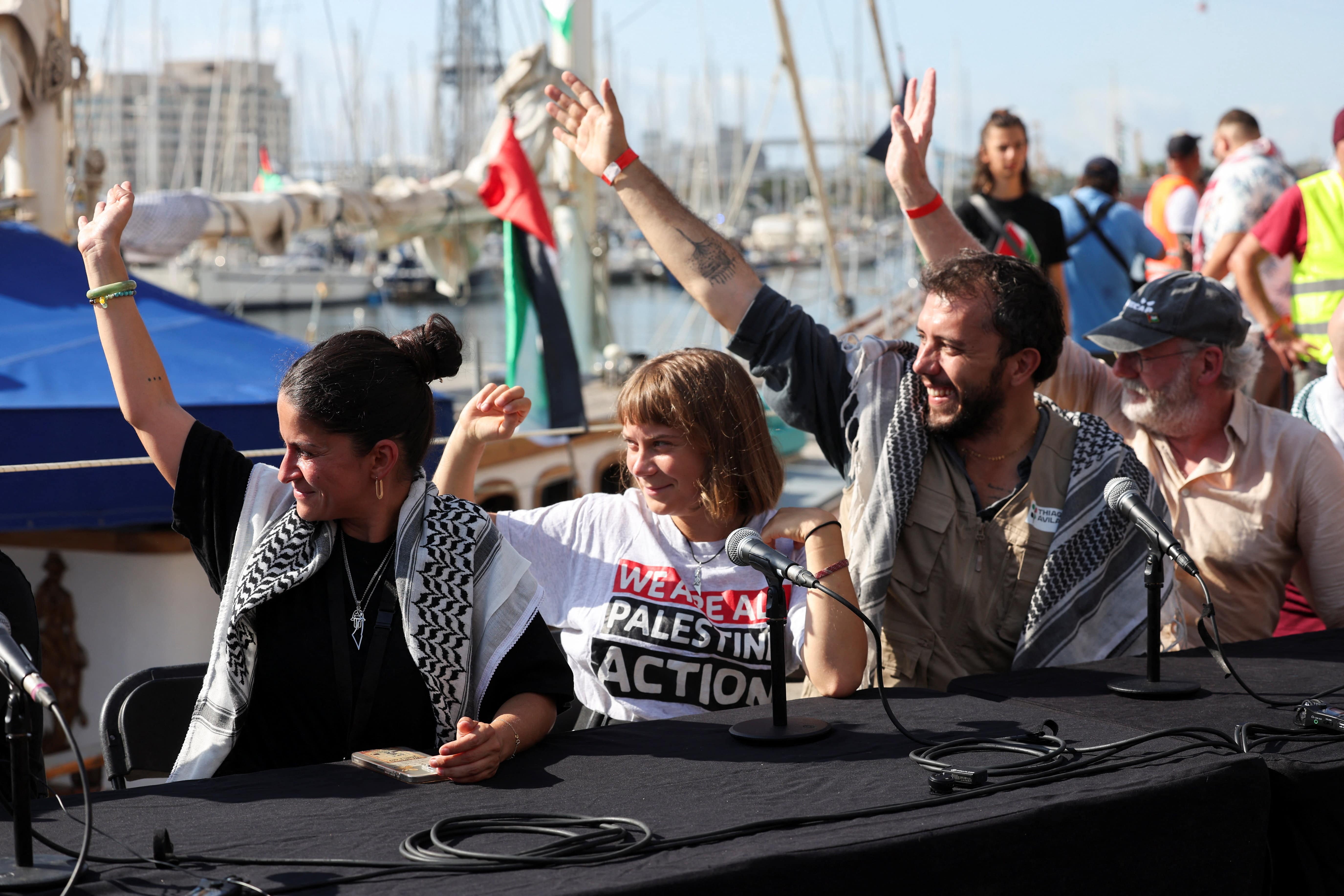 Activists Yasemin Acar, Greta Thunberg, Thiago Avila and Irish actor Liam Cunningham, wave during a press conference for the Global Sumud Flotilla (Reuters/Eva Manez)
