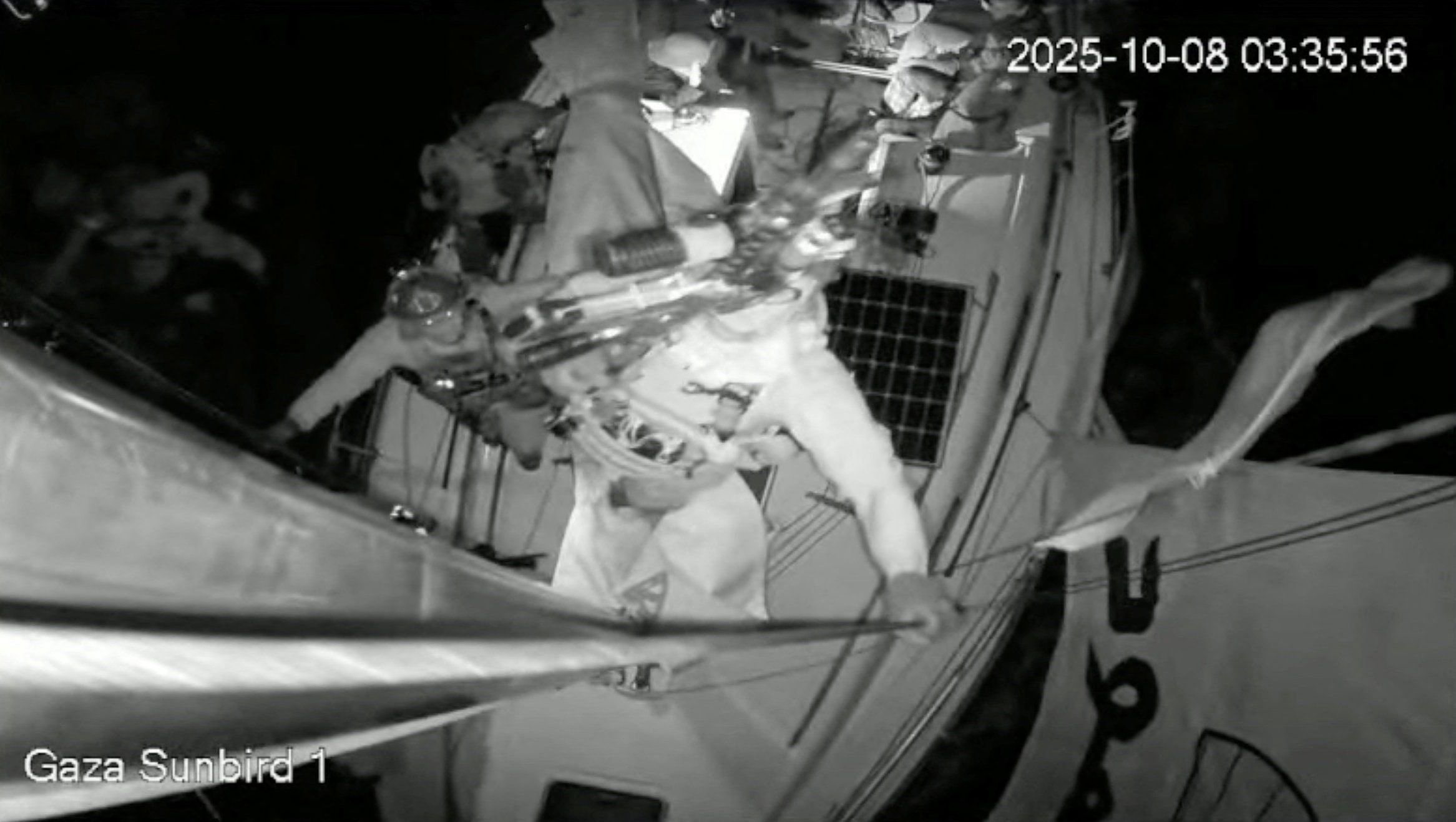 A screengrab from a live footage video shows an Israeli soldier smashing the CCTV camera of 
