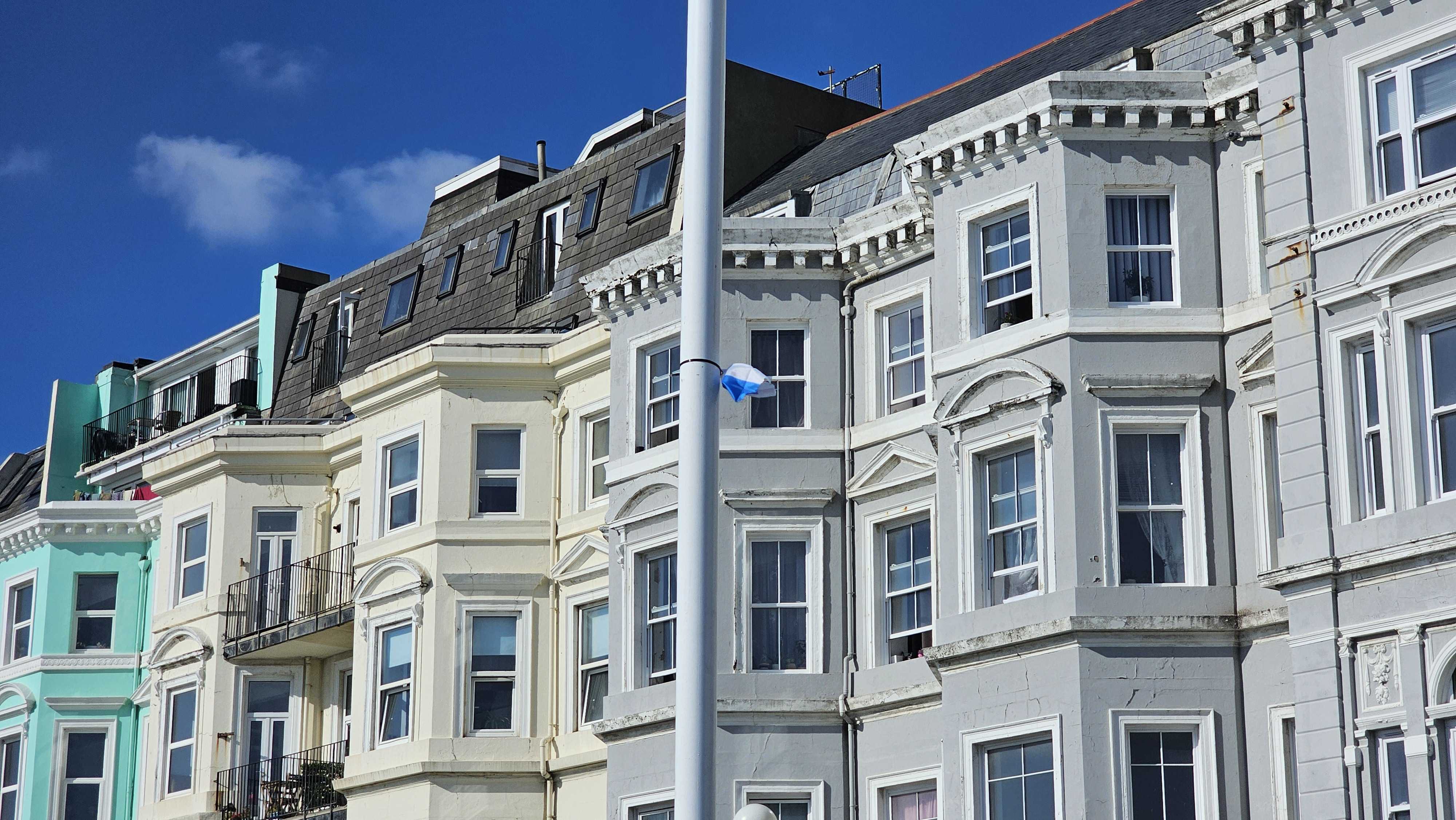 Remnants of an Israeli flag cling to a lamppost on Hastings seafront, Hastings, UK, 9 October 2025 (MEE/Ayah El-Khaldi)