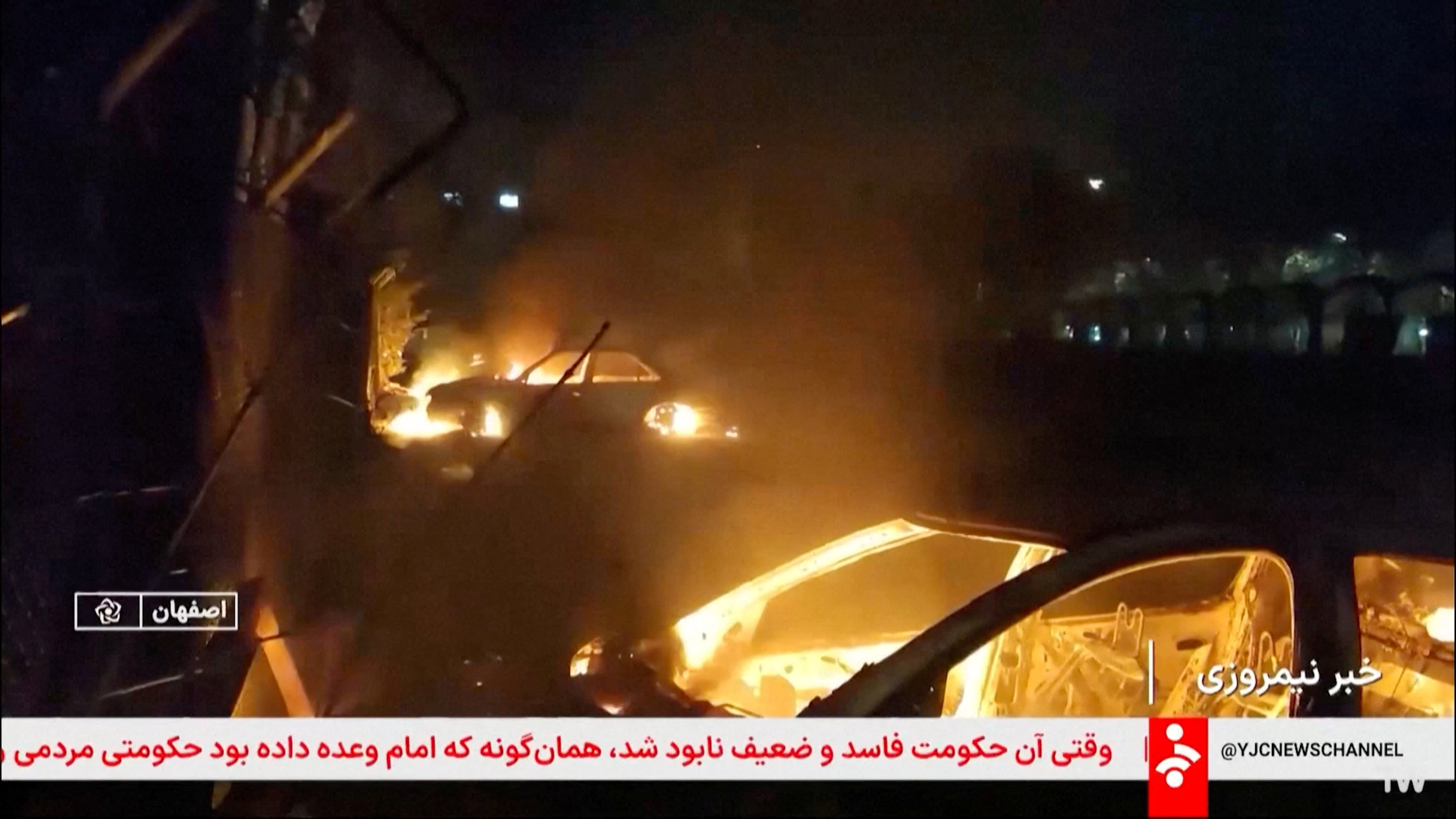 Flames engulf cars following unrest sparked by dire economic conditions, in a place given as Isfahan, Iran, 9 January 2026, in this screengrab from Iran's state media broadcast footage (Reuters)