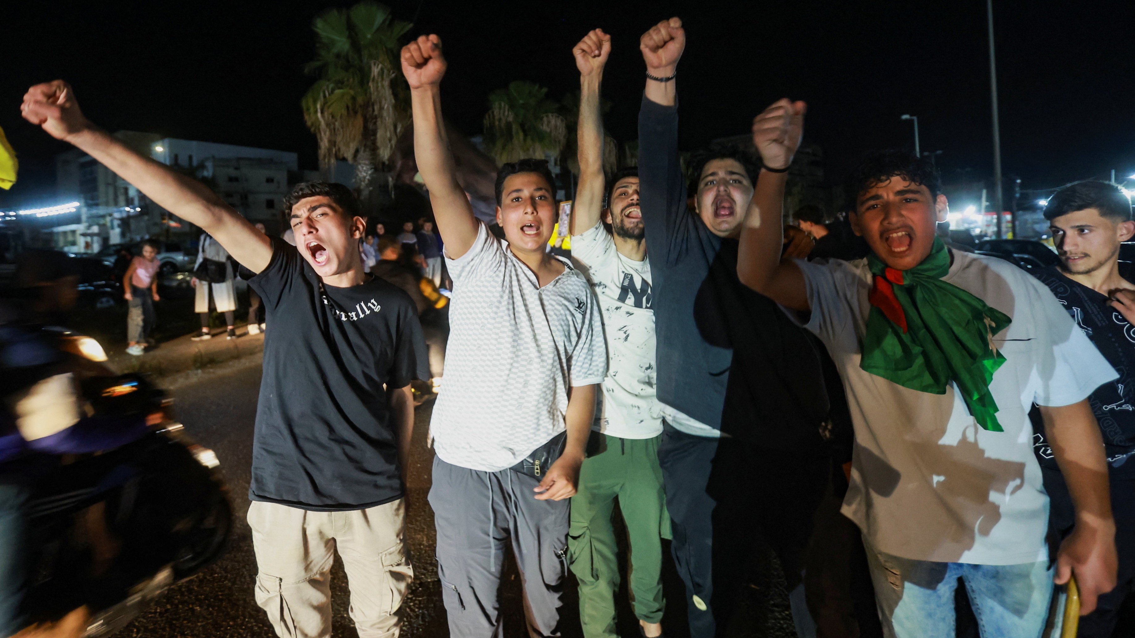 A group of men celebrates after a 10-day ceasefire between Lebanon and Israel went into effect, in Sidon, Lebanon, 17 April , 2026 (Reuters/Aziz Taher)