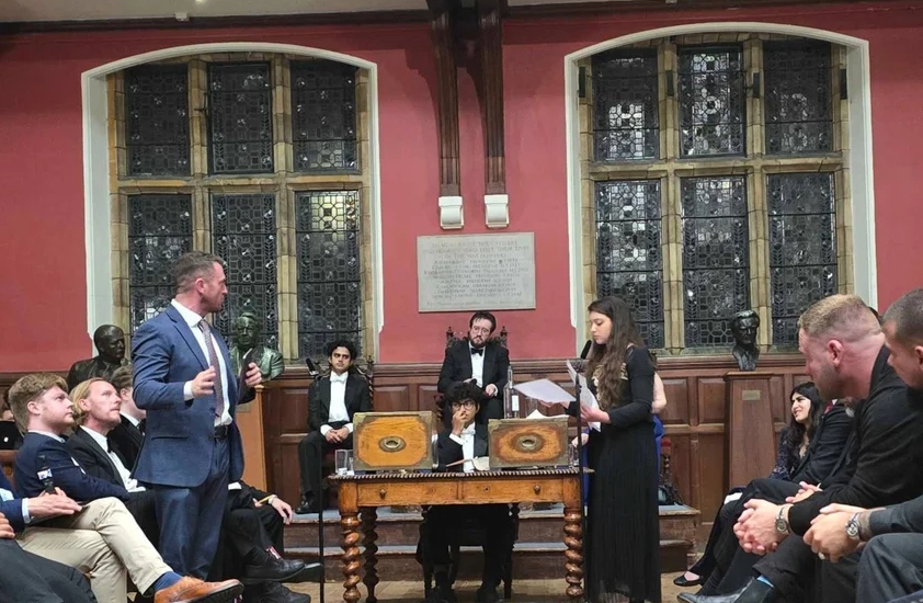 Tommy Robinson and Arwa Elrayess at the Oxford Union on Wednesday (MEE/Imran Mulla)
