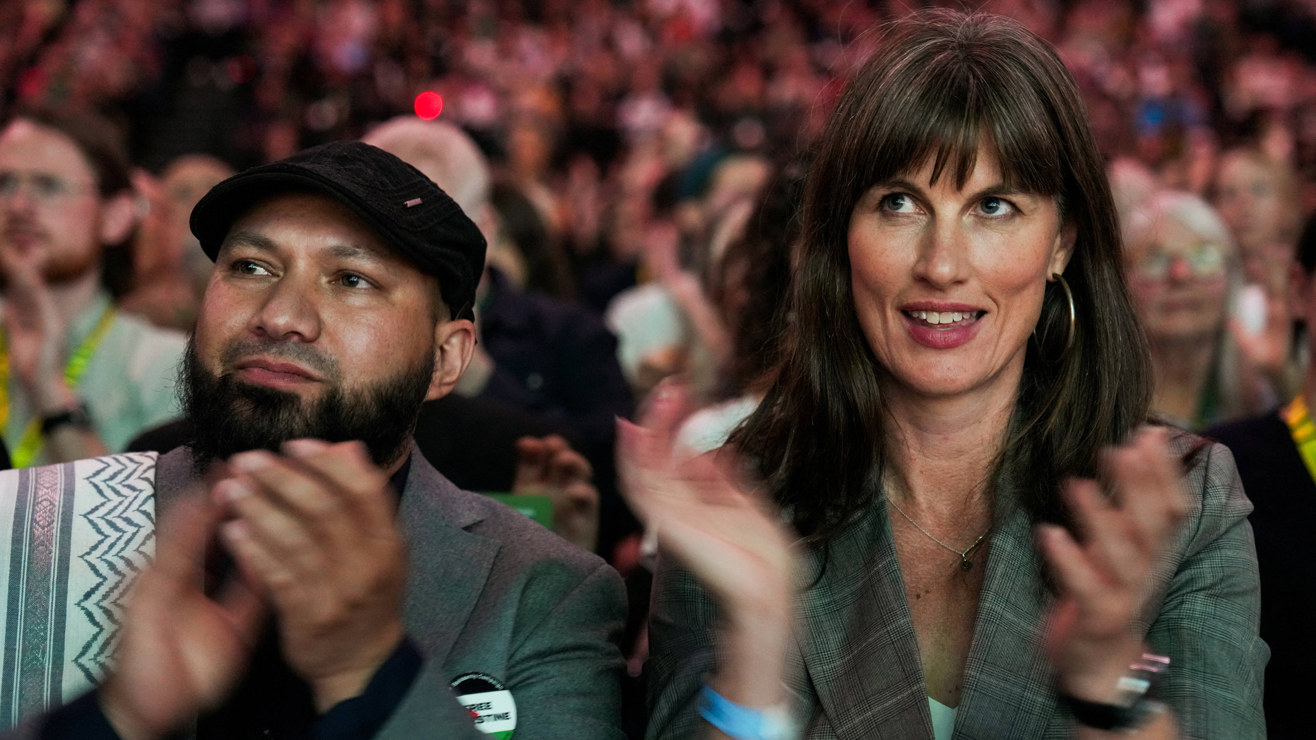Green co-leaders Mothin Ali and Rachel Millward sit together at the Green Party conference on Friday in Brighton. (Reuters)