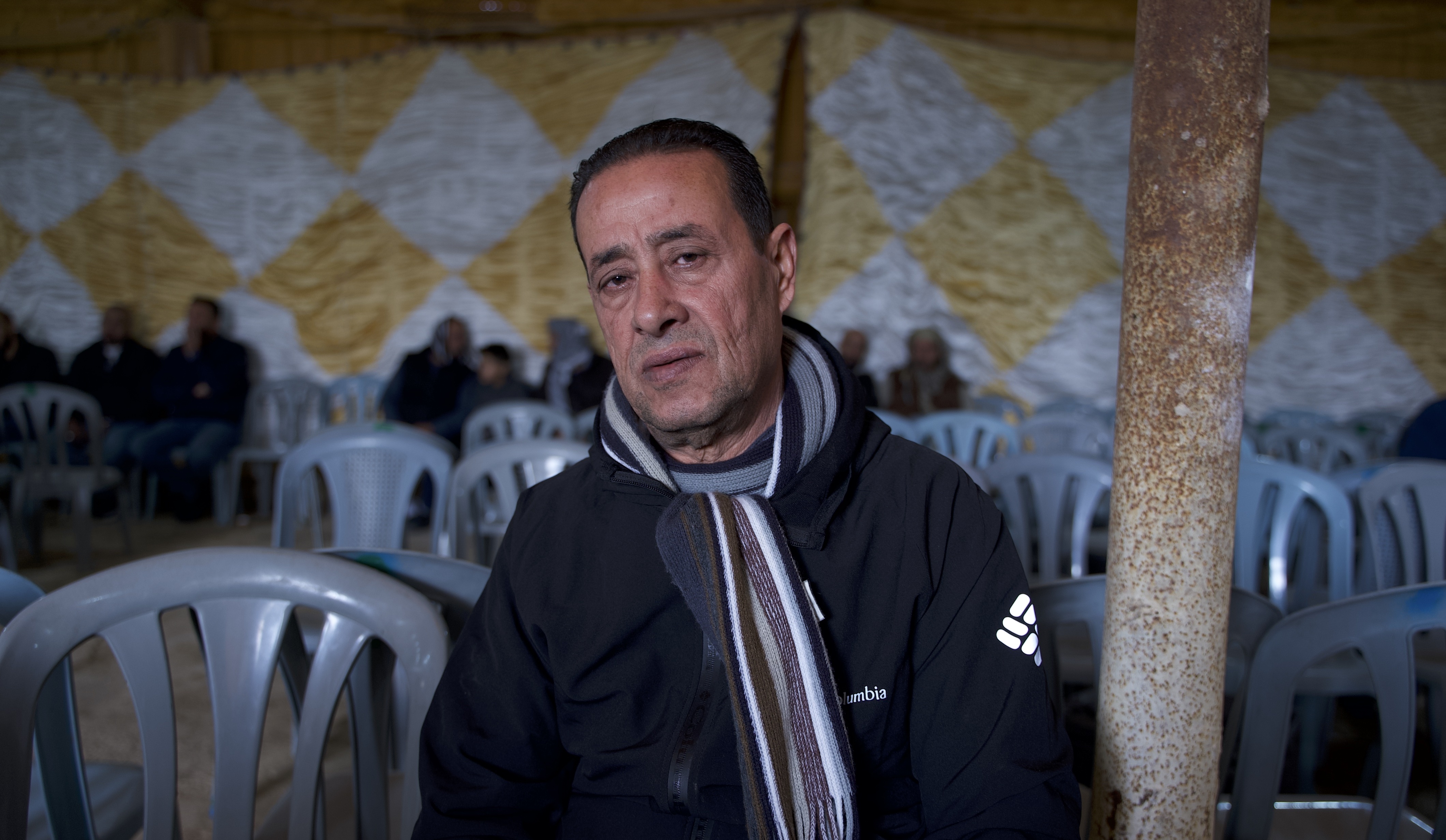 Jamal Aweidat, 54, at the funeral service to mourn his nephew, Thaer Aweidat, 28, on Monday 6 February, 2023 (MEE/Akram al-Waara)