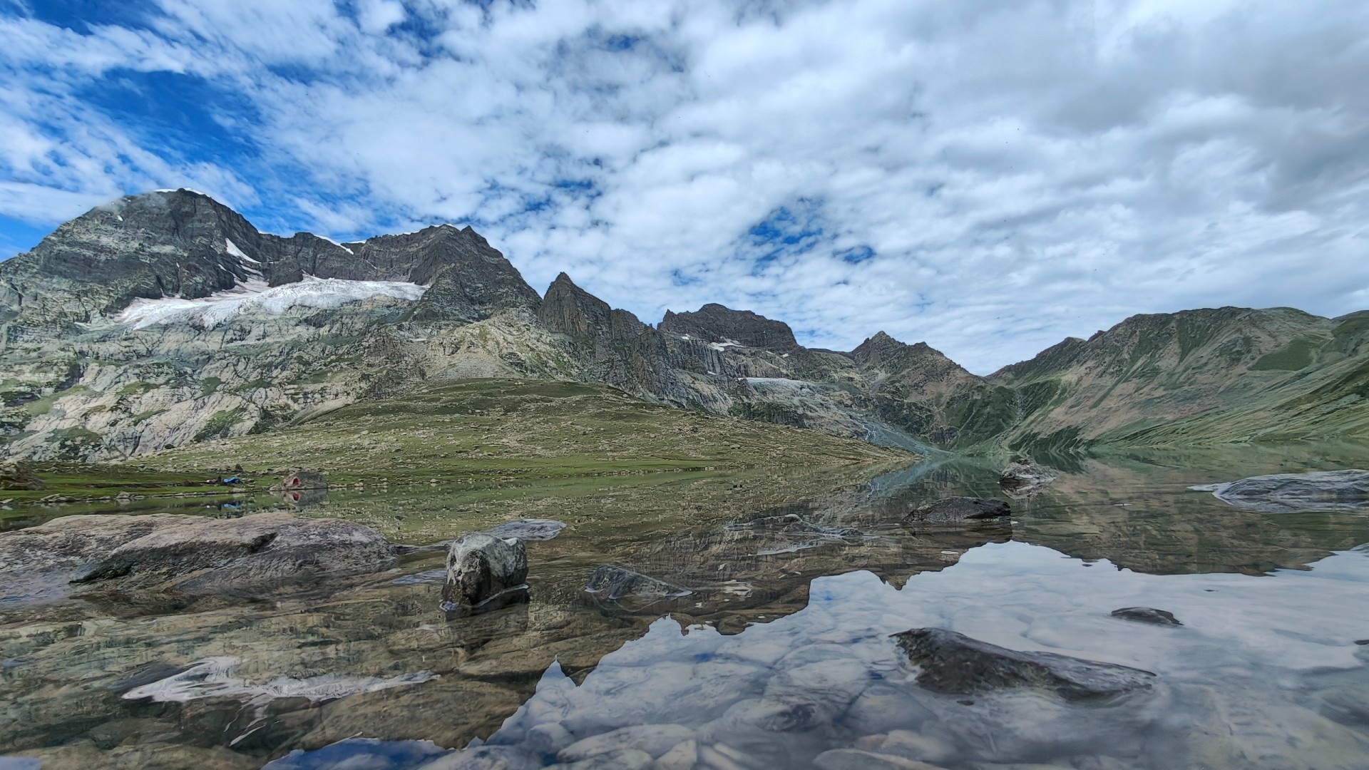 Gangbal Lake, one of Kashmir’s breathtaking high-altitude destinations, reflects the region’s pristine wilderness as trekking activities remain under a ban