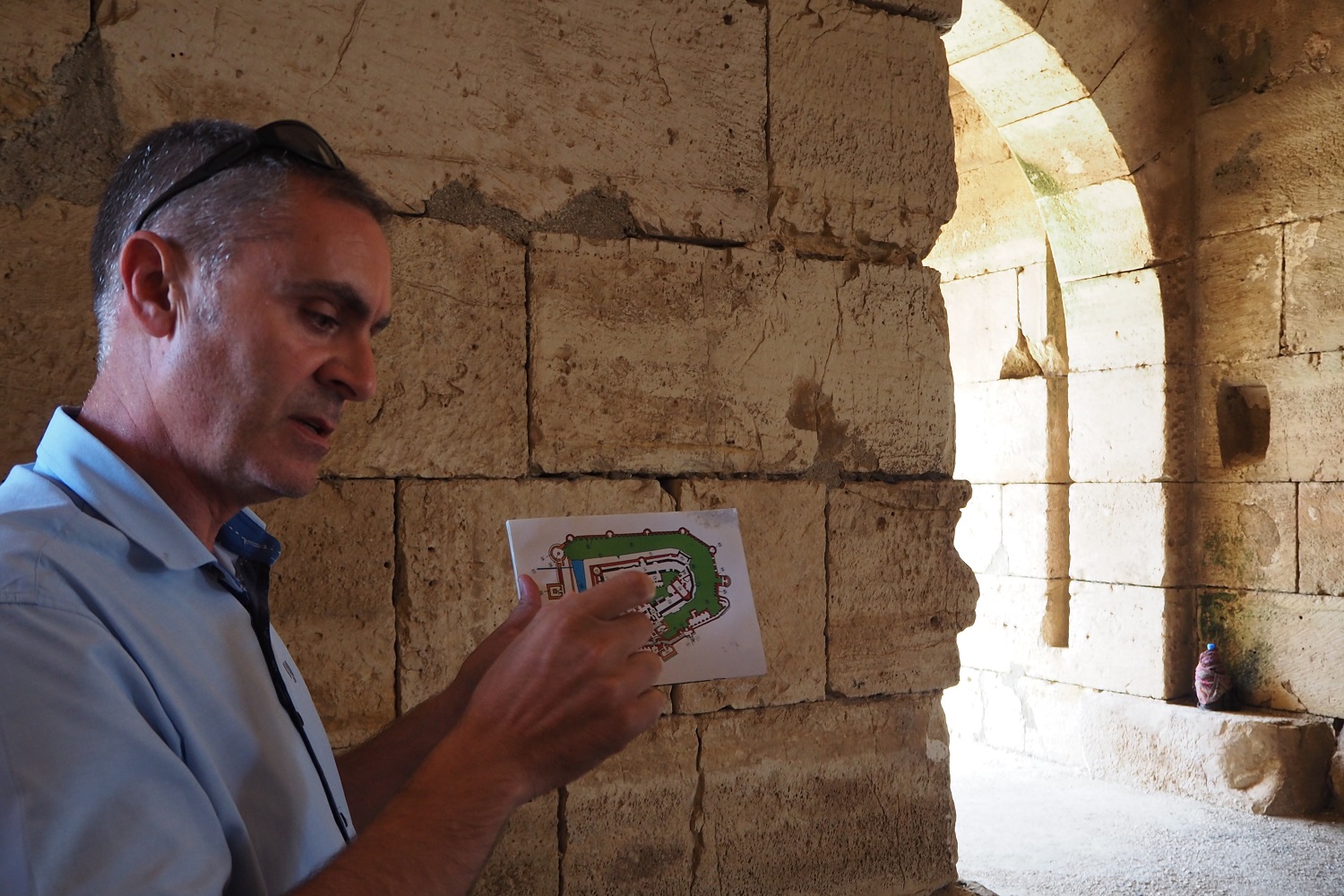  Hazem Hunno, civil engineer and head of architecture at the castle, explains some of the architectural features (Tom Westcott/MEE)