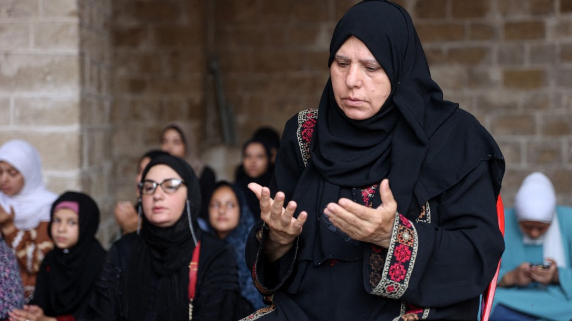 Palestinian woman Eid prayers Gaza City June 16