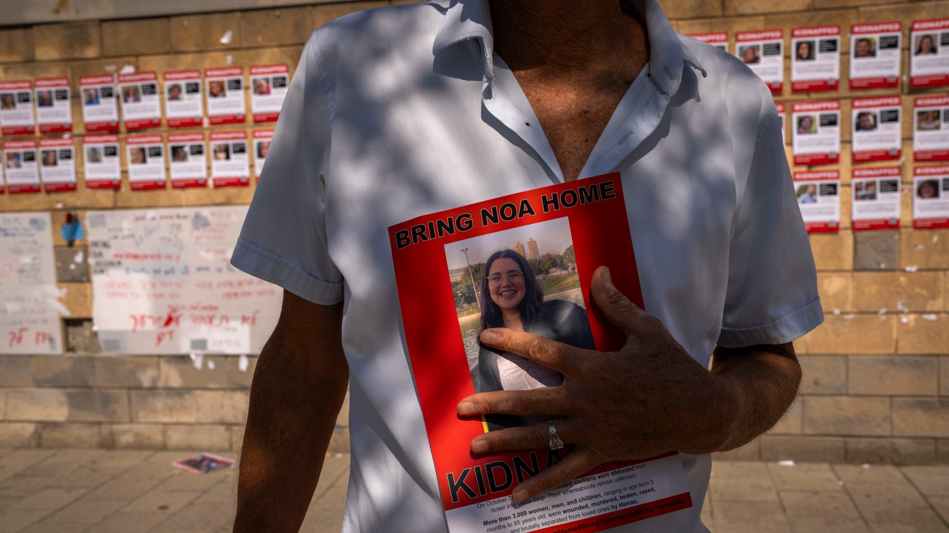 Families and supporters of Israelis held captive in Gaza call for their release during a demonstration in Tel Aviv, 18 October (AP/Petros Giannakouris)