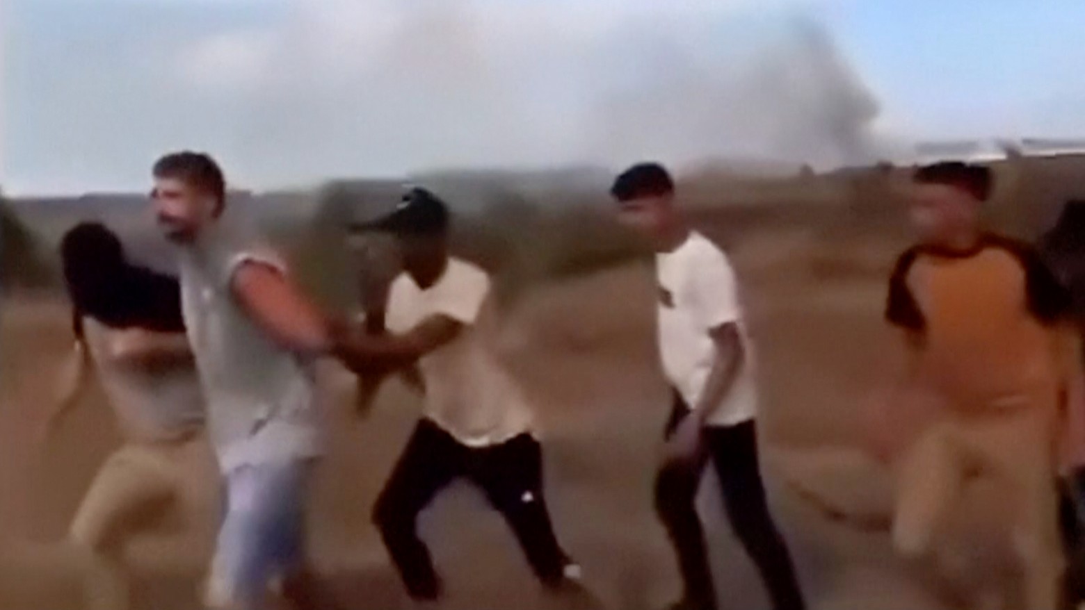 Avinatan Or, second left, and his partner, Noa Argamani, not pictured, are seized by Palestinian fighters on 7 October (AP)