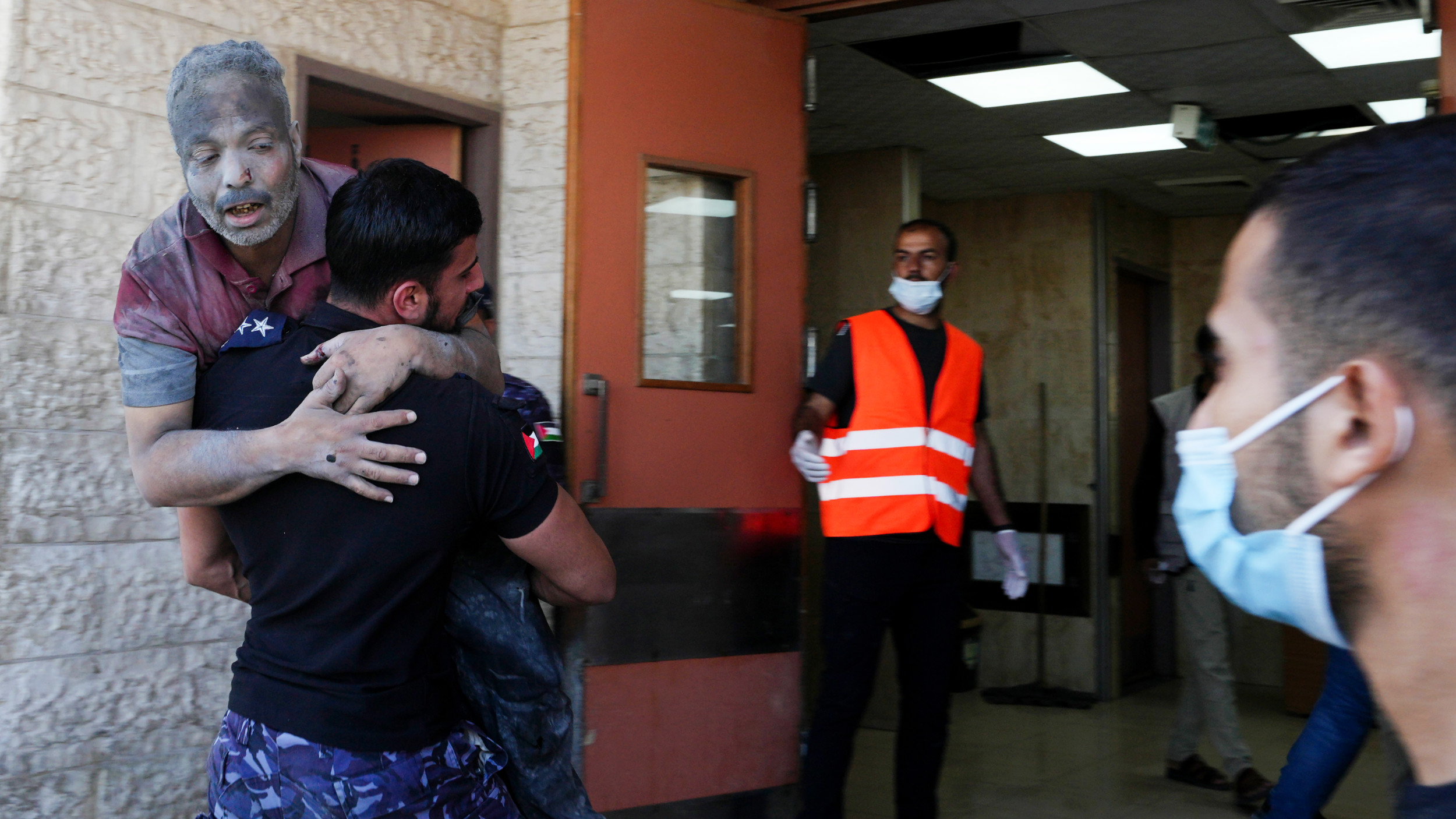 Palestinians wounded in Israeli air strikes on Gaza Strip are brought to al-Aqsa hospital in Deir el-Balah City, Gaza Strip, 14 October 2023 (AP)