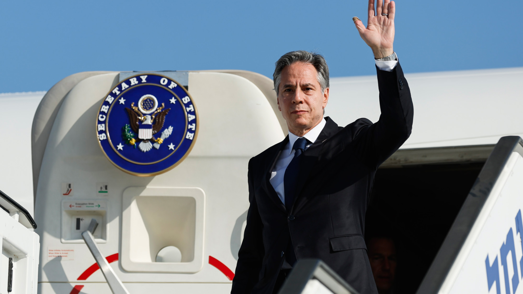 US Secretary of State Antony Blinken waves as he disembarks from an aircraft on his arrival in Tel Aviv, Israel 3 November 2023 (AP)