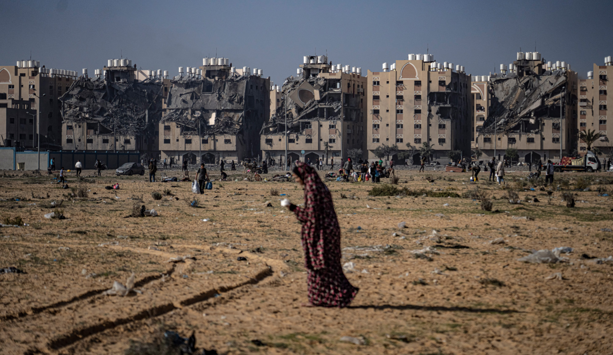 Palestinians flee from east to west of Khan Younis, Gaza Strip, during the ongoing Israeli bombardment, Saturday, 2 December 2023 (AP)