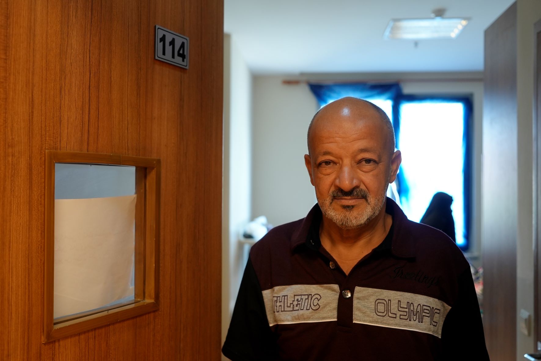 Abu Mustafa standing outside Aseel Fadhal's room inside Zakho General Hospital (MEE/Azhar Al-Rubaie)