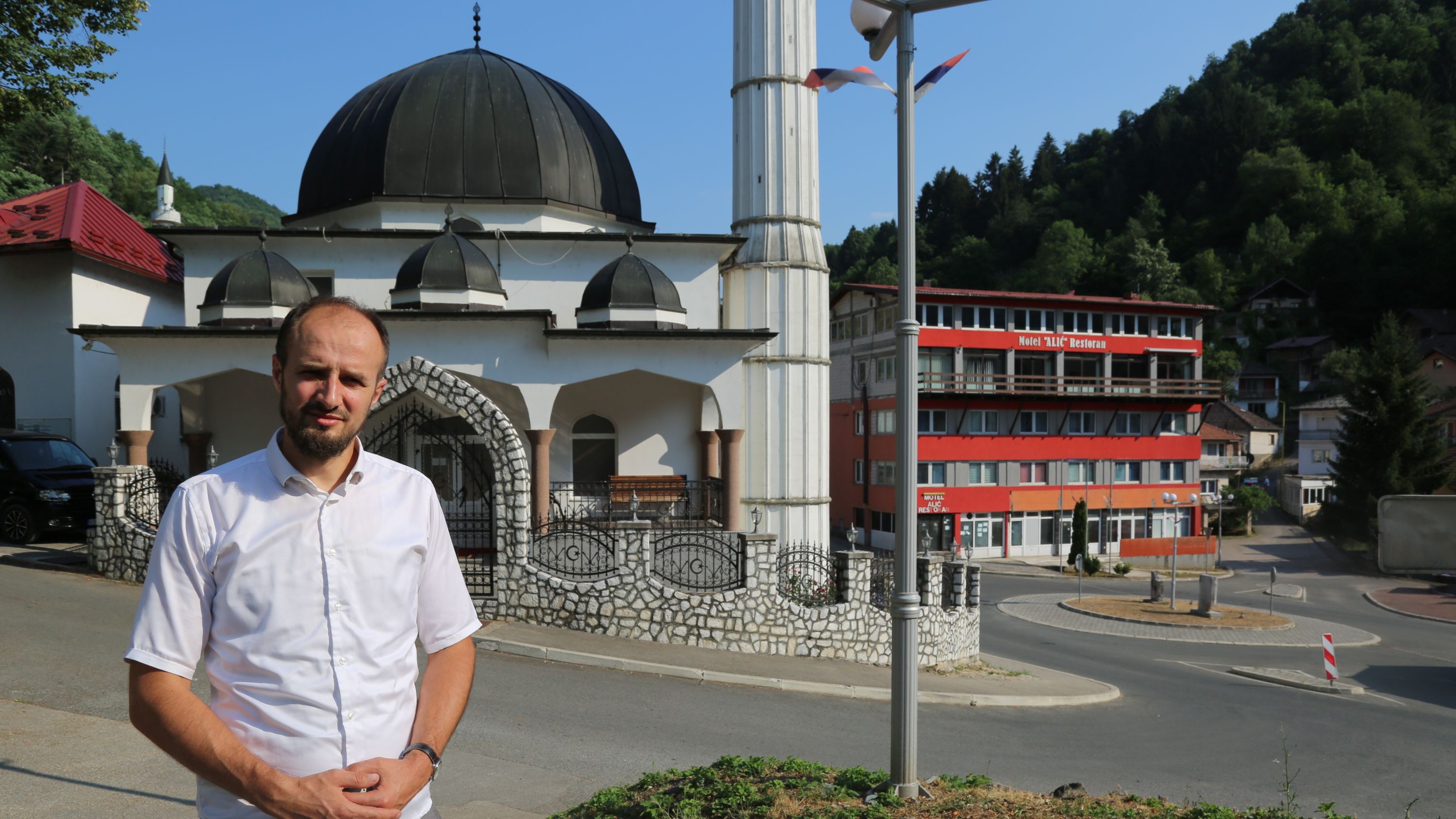 Ahmed Hrustanovic in front of the mosque where he works in Srebrenica, Bosnia (Mersih Agadzo/MEE