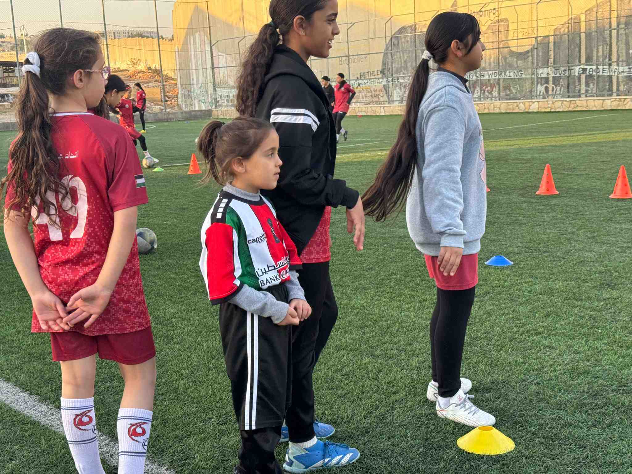 Children from Aida refugee camp take part in a coaching session (Lubna Masarwa/MEE)