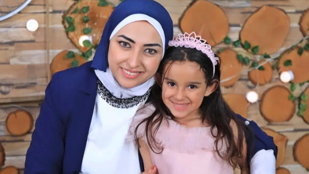 Alaa al-Qattrawi with her daughter Orkida in an undated photo; Orkida was killed along with her siblings in an Israeli air strike on their home in Khan Younis in December 2023 (Facebook)