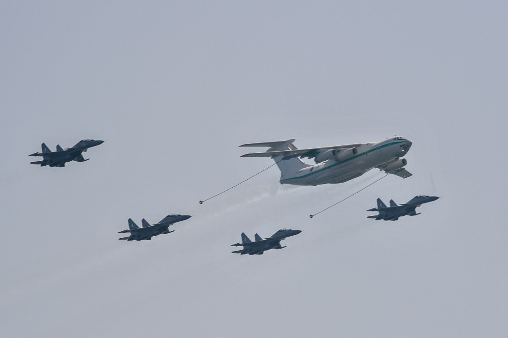 Algerian air force Sukhoi Su-30 fighter aircraft fly in formation alongside an Ilyushin IL-78 aerial refueling tanker over the capital Algiers on 5 July 2022, as the country celebrates the 60th anniversary of its independence (Ryad Kramdi/AFP)