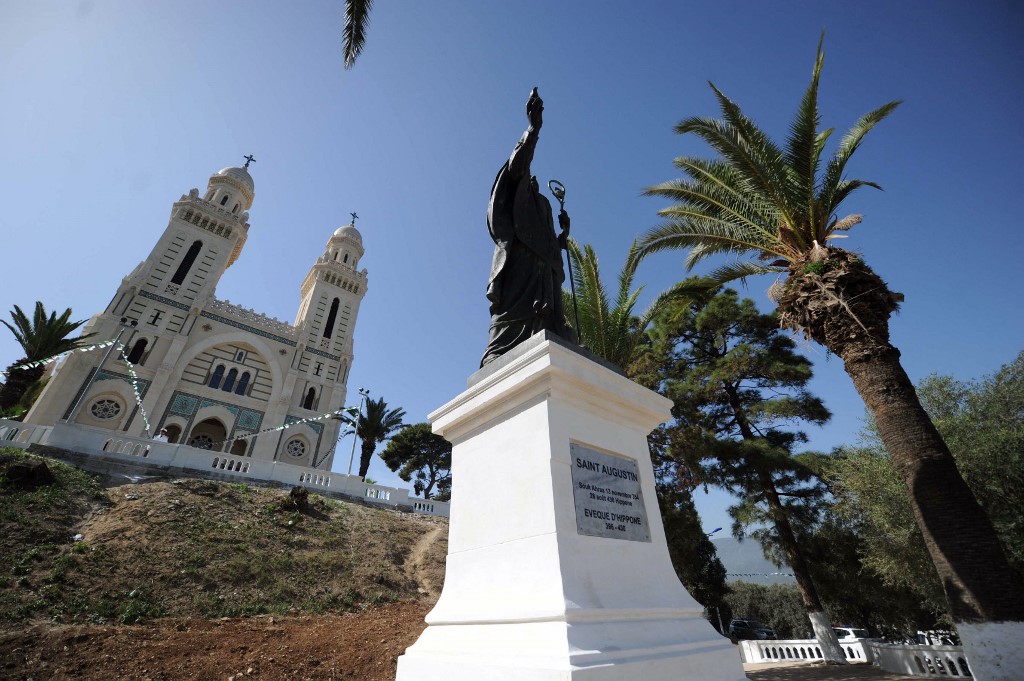 A statue of Saint Augustine in front of the Saint Augustine Basilica after its following restoration works, in Annaba, Algeria, 19 October 2013 (Farouk Batiche/AFP)