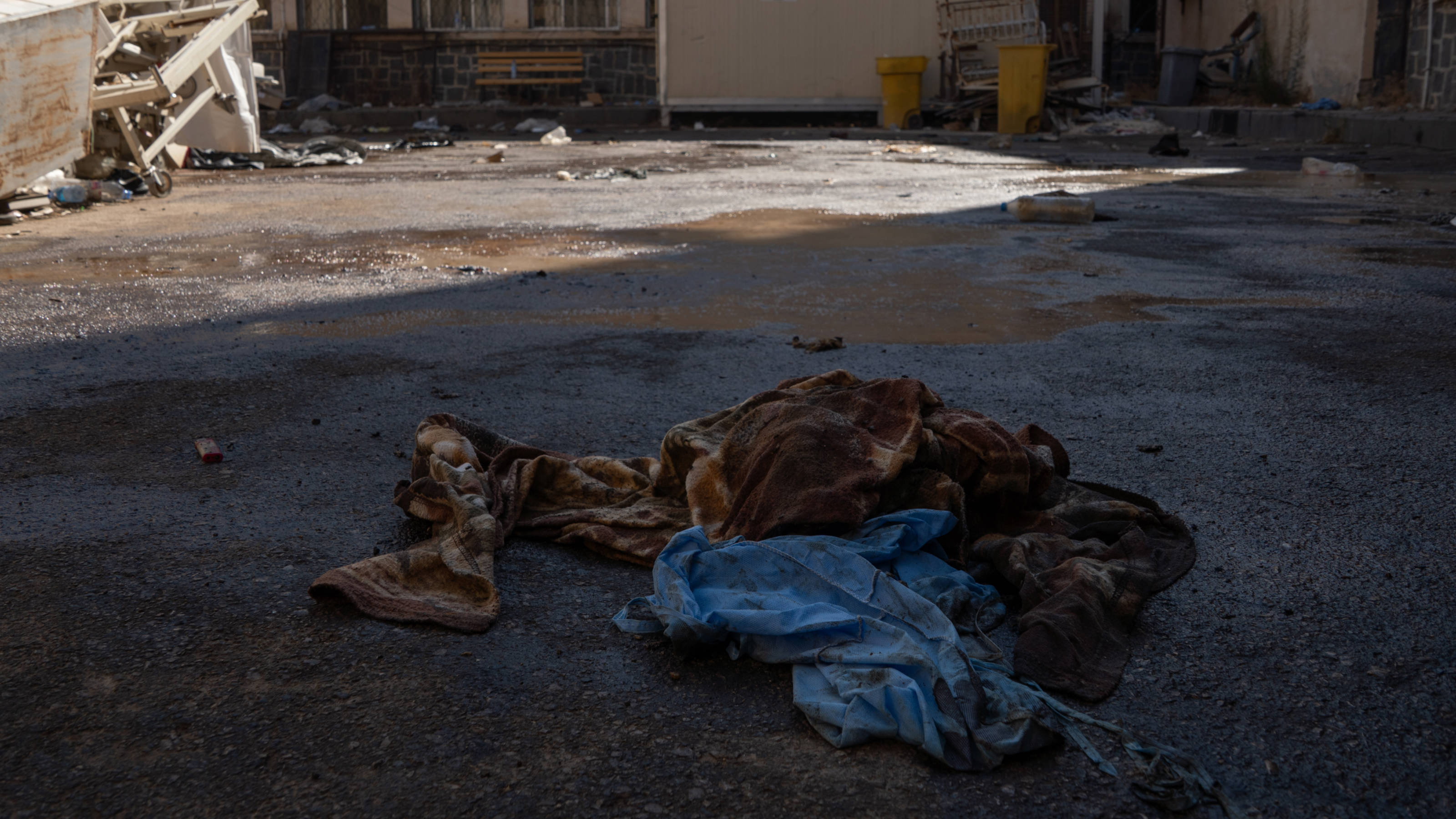 Blood-soaked scrubs discarded in the compound of Sweida National Hospital (Anagha Subhash Nair/MEE)