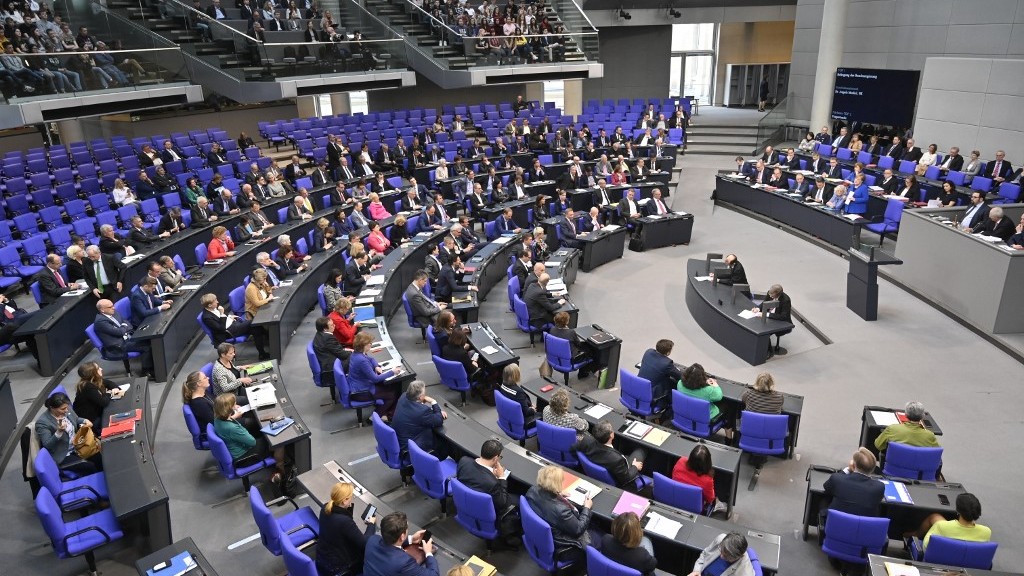 German Chancellor Angela Merkel speaks during question time at the Bundestag, a month before the BDS resolution was passed in 2019 (AFP)
