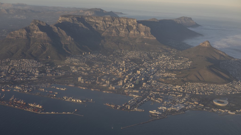 A general view of Devils Peak (L), Table Mountain and the city center (C), and Lions Head (R) in Cape Town on June 13, 2024. Wikus de Wet / AFP