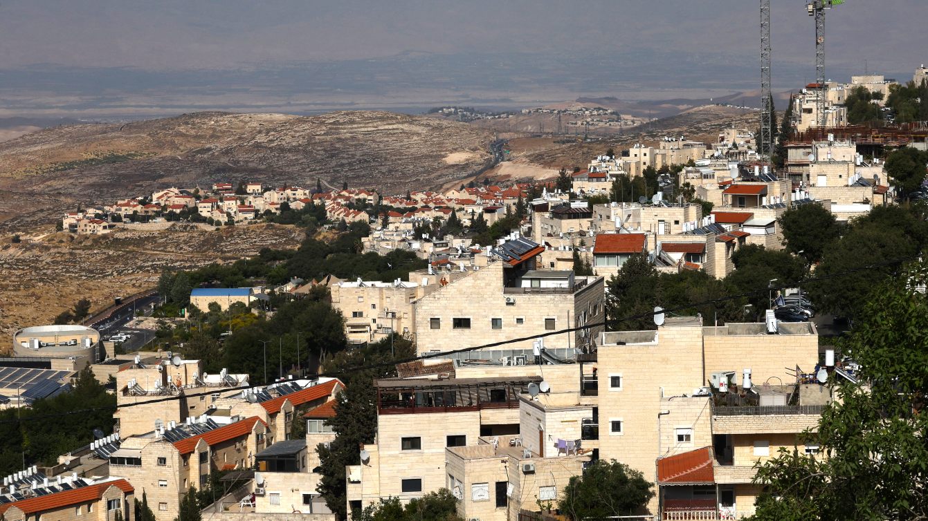 Construction cranes operate in the Israeli settlement of Pisgat Zeev in annexed east Jerusalem, 22 May 2026 (Ahmad Gharabli/AFP)