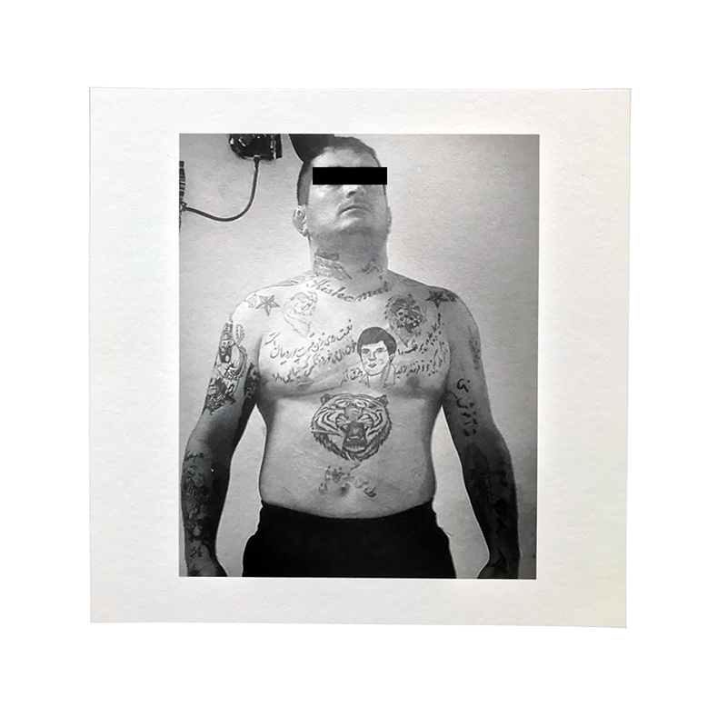 Moradi’s best friend and most loyal henchman, posing to show his tattoos and 'battle' scars. (Pouria Khojastehpay) 