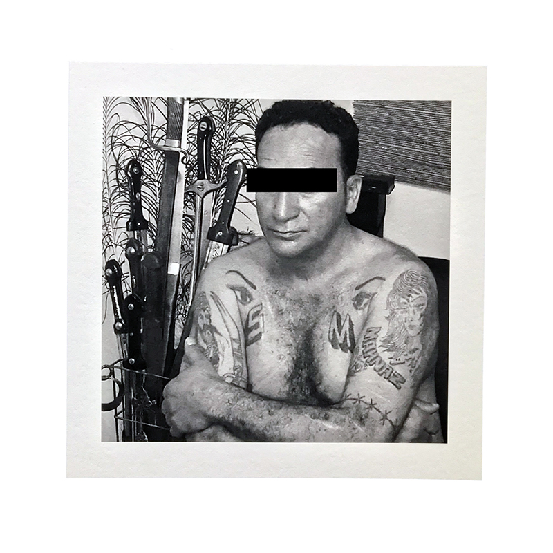 This man is posing in front of a collection of short Persian swords known as “ghameh” that are used in brutal knife fights and ib Shia mourning rituals that are legally banned under Iranian law. He is now reformed, and is working to rehabilitate drug addicts in Iran (PK)