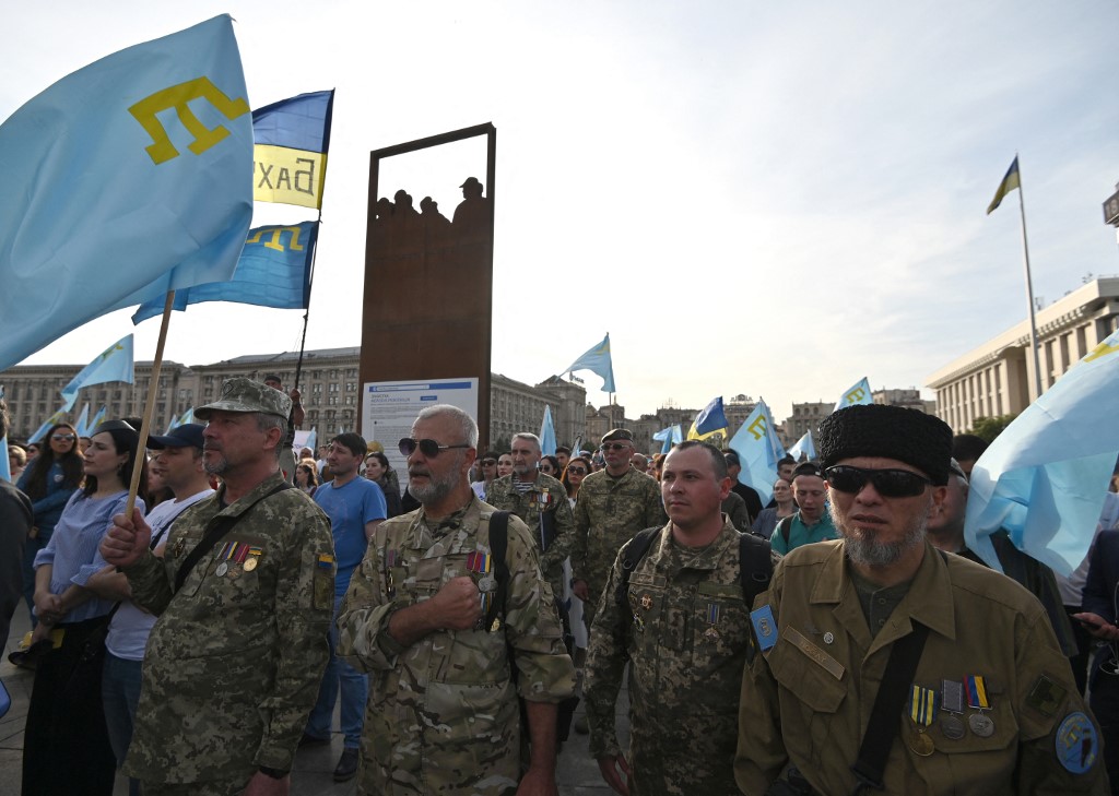 Crimean Tatars, veterans of war against Russia-backed separatists, take part in a memorial ceremony on the Independence square in Kiev on 18 May 2019 (Genya Savilov/AFP)