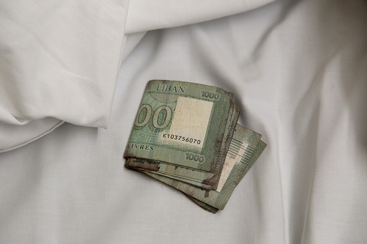 “These blood-stained L£18,000, barely USD 2.25 due to Lebanon’s economic crisis, were found in the pocket of Georges, a 79-year-old taxi driver badly injured in the 4 August explosion. His daughter wants to keep them, as a reminder of this most horrific day. Shot Friday, August 7, three days after the explosion.