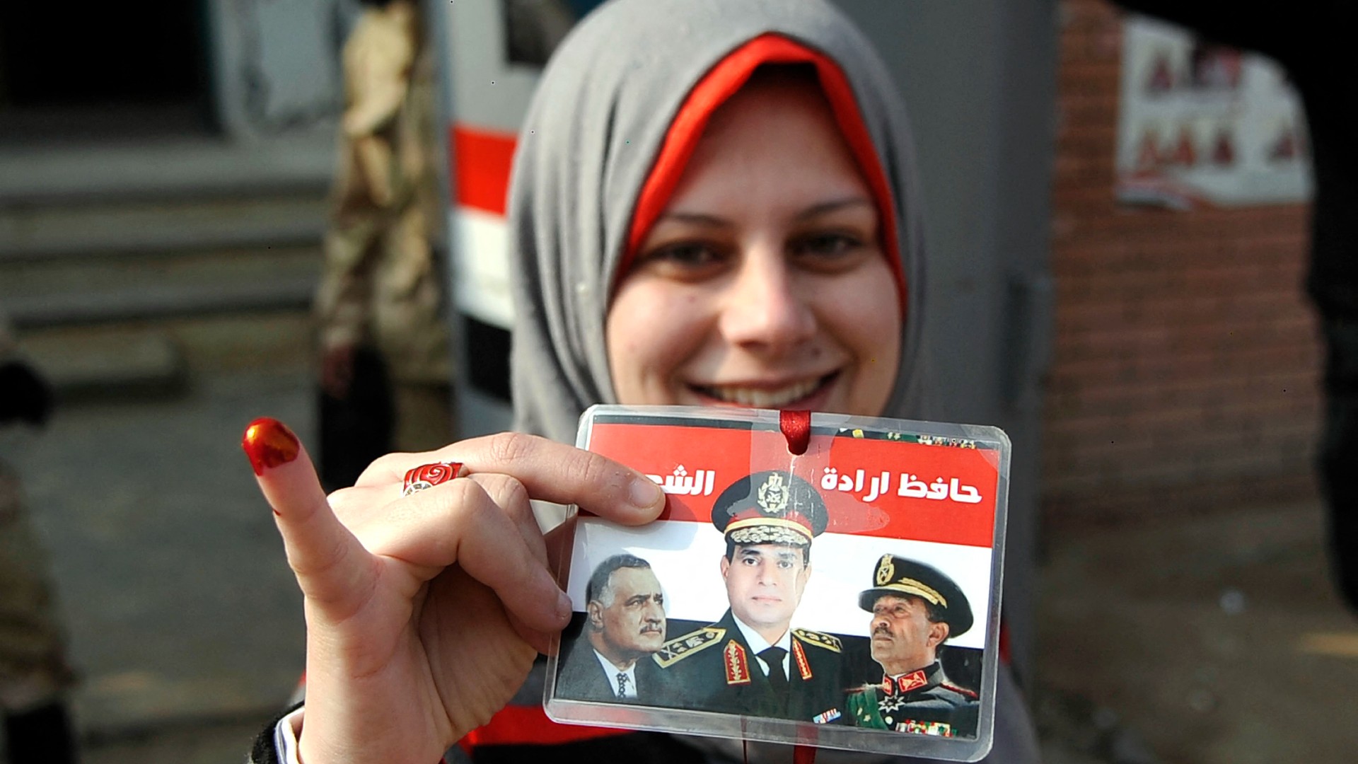 Portraits of Egyptian President Abdel Fattah al-Sisi and Nasser are seen in Cairo in 2015 (AFP)