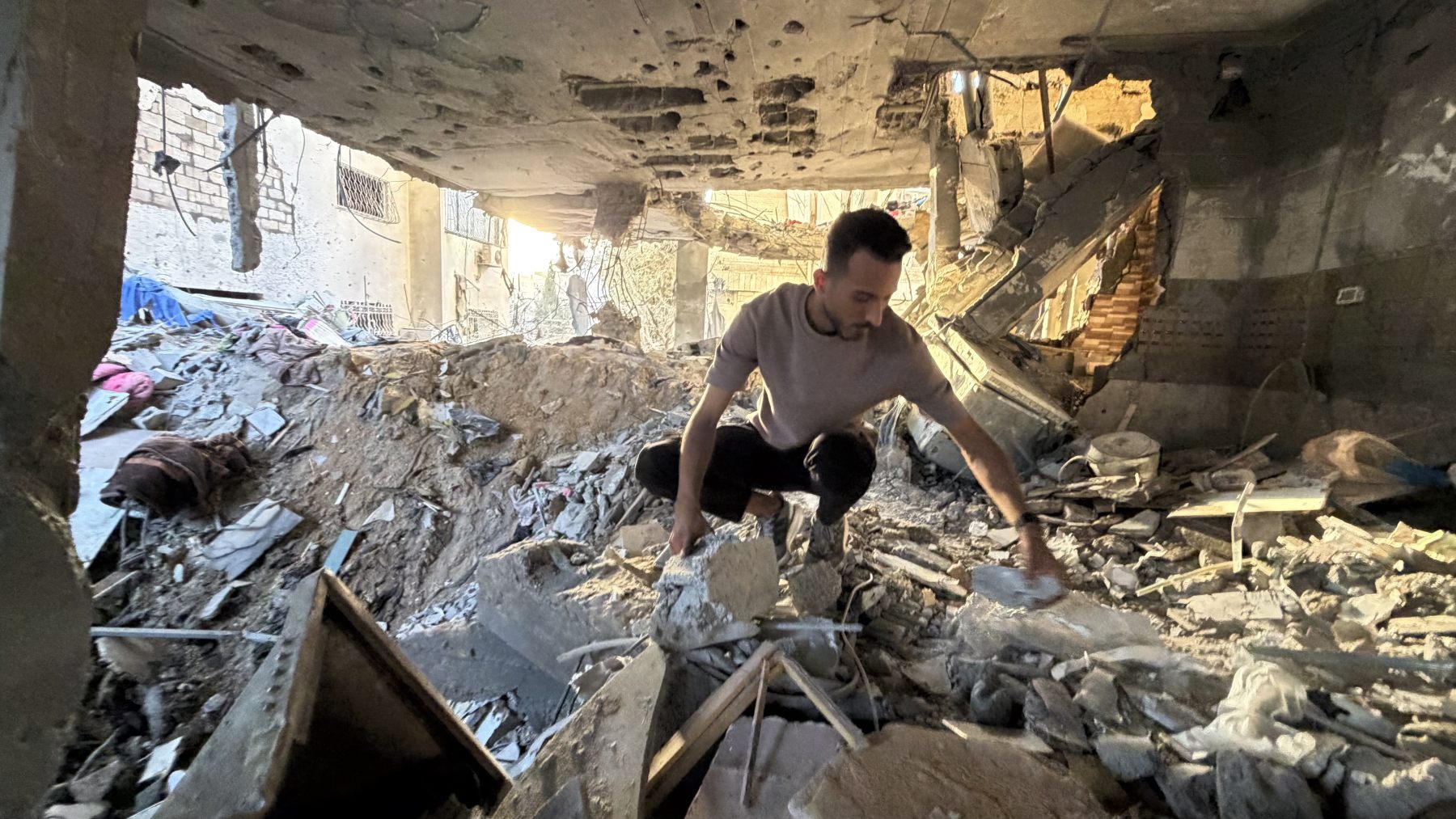 Emad Kullab, 30, in the building where he was when strikes killed Mary Abu Dawud and her mother Maysaa in Gaza City (Middle East Eye)