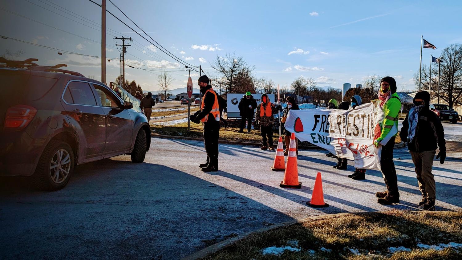 Protesters prevent workers at a local weapons manufacturing plant from entering, in protest of US weapons being sent to Israel.