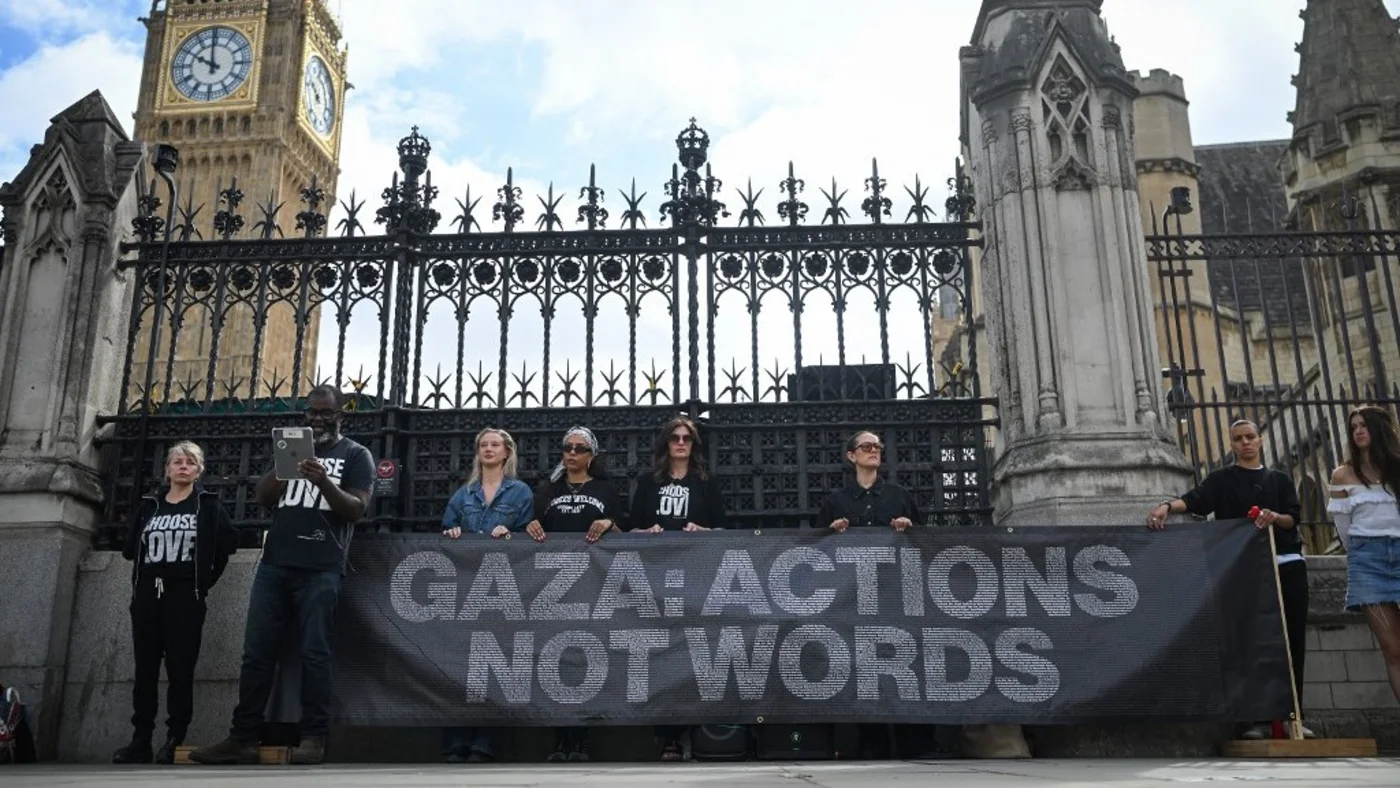 Photographer Misan Harriman reads out some of the names of over 15,000 children killed in Gaza in London on 29 May 2025 (Justin Tallis/AFP)