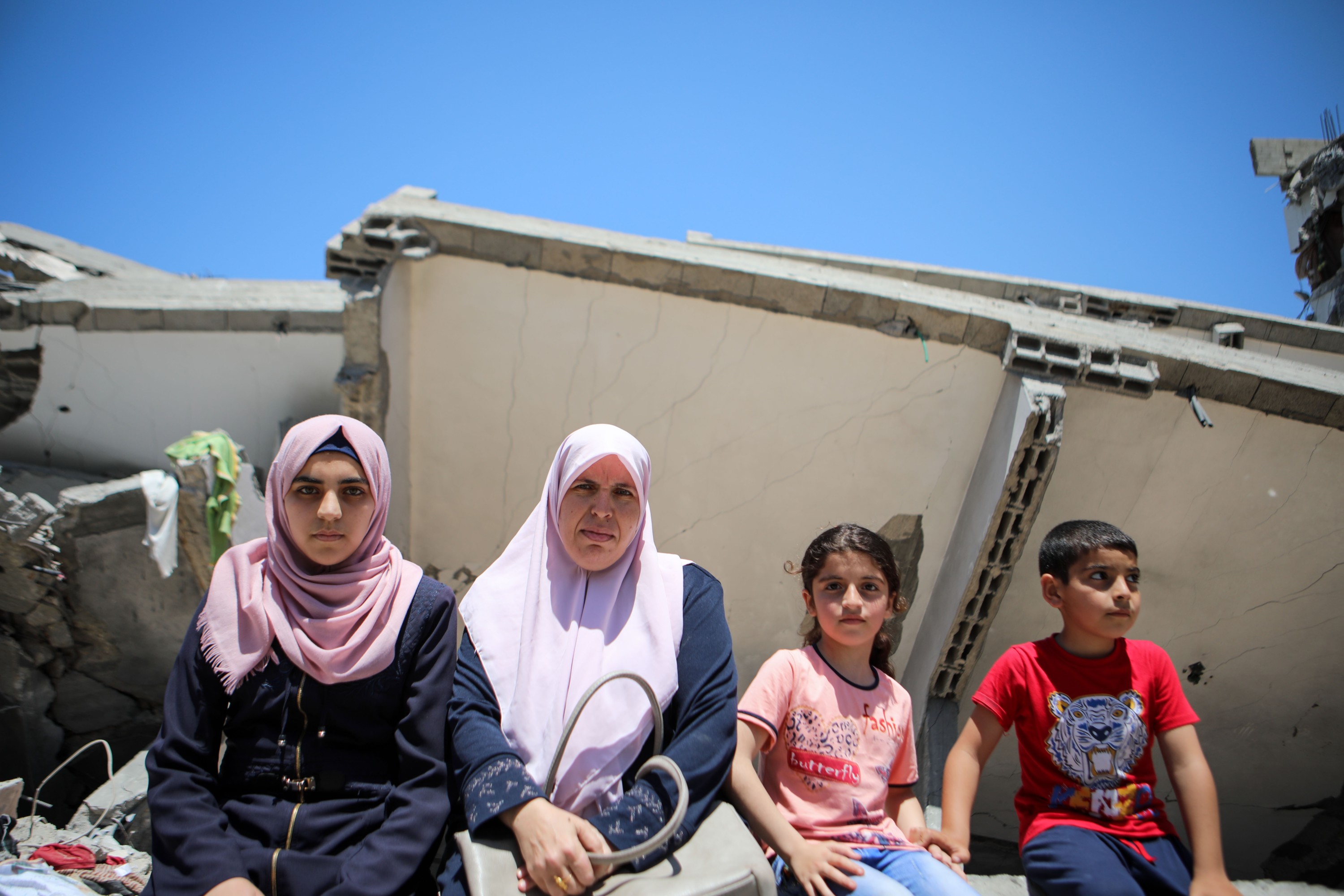 'We didn’t just lose a house, clothes or items of furniture, but our past, our memories, our future and our dreams,' said Marwa Issa, sitting here with two of her daughters (MEE/Mohammed al-Hajjar)