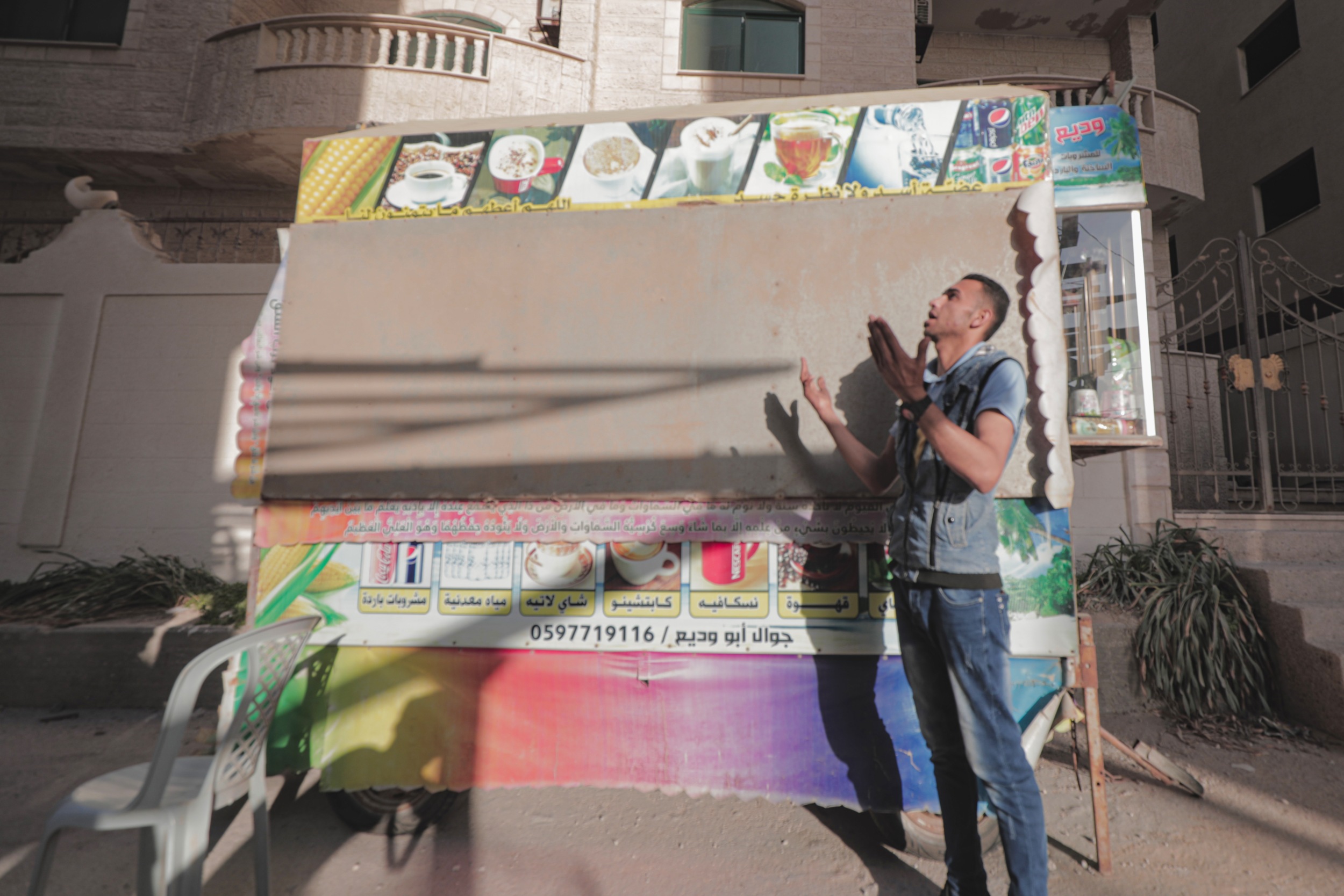 'If we increase prices, our businesses will close,' says Tamer Doghmosh, who has been forced to take his cart off the beach by the Gaza City municipality (MEE/Mohammed Salem)