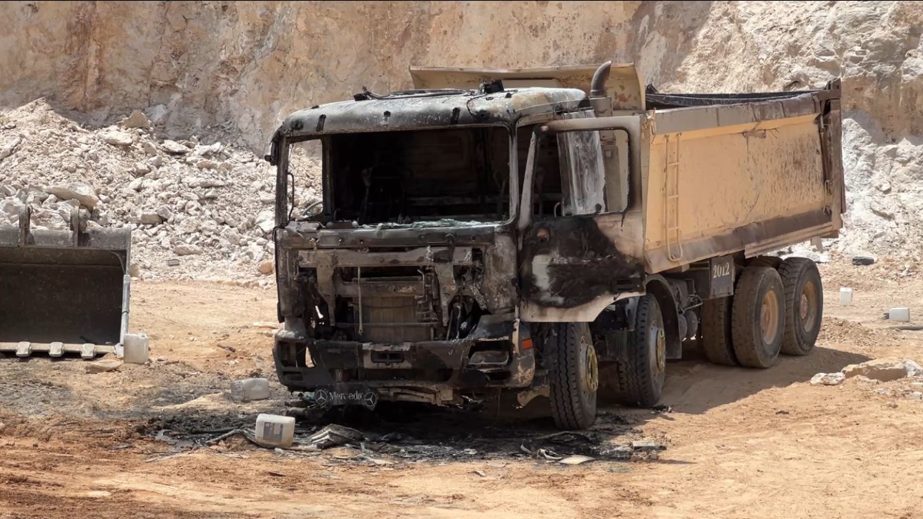 Heavy machinery burned in an attack by Israeli settlers on a stone quarry near Ein Samiya, northeast of Ramallah in the occupied West Bank (Mohammed Turkman/Middle East Eye)