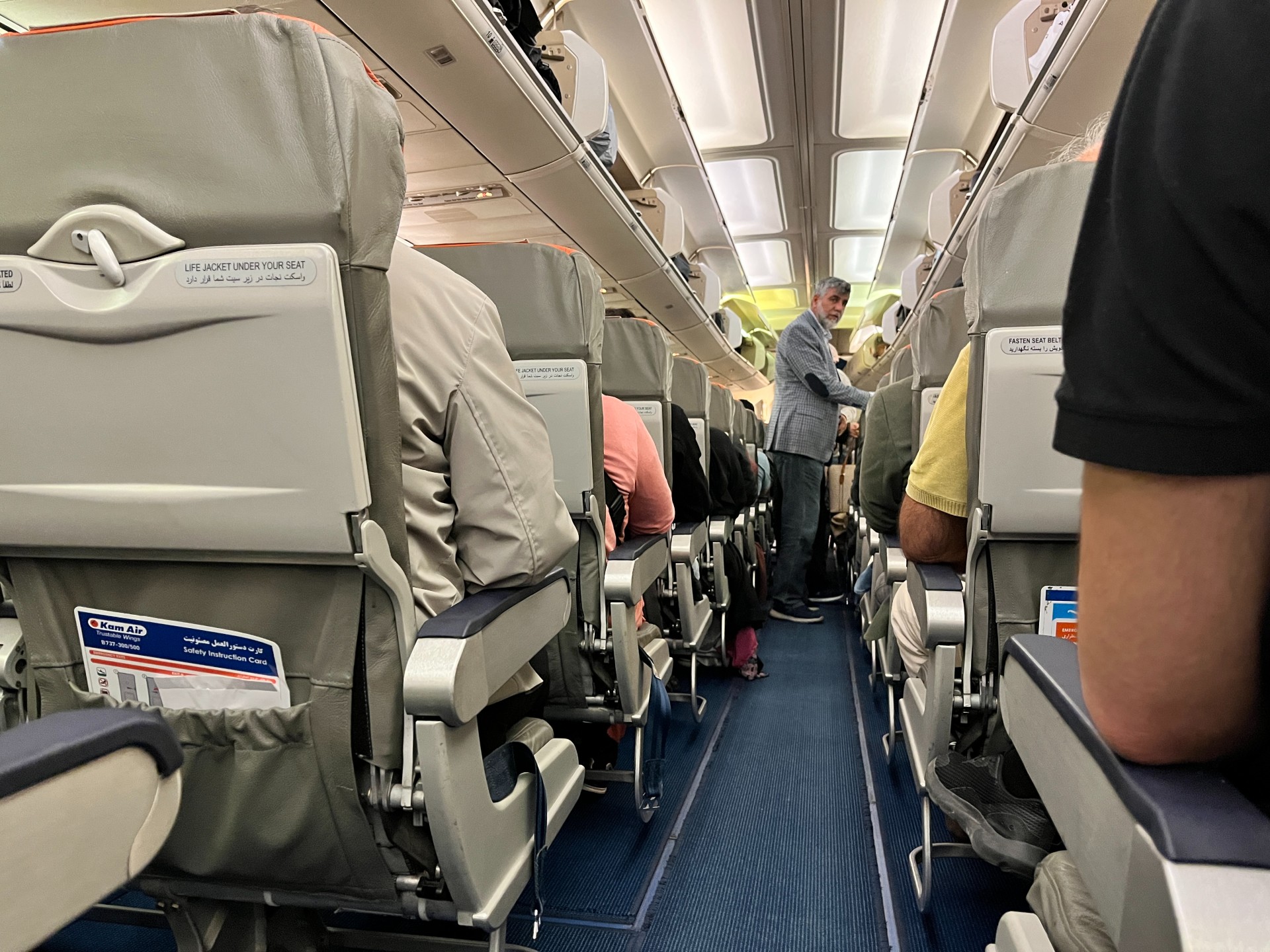 Passengers settle into the KamAir flight from Istanbul to Kabul (MEE/Ali M Latifi)