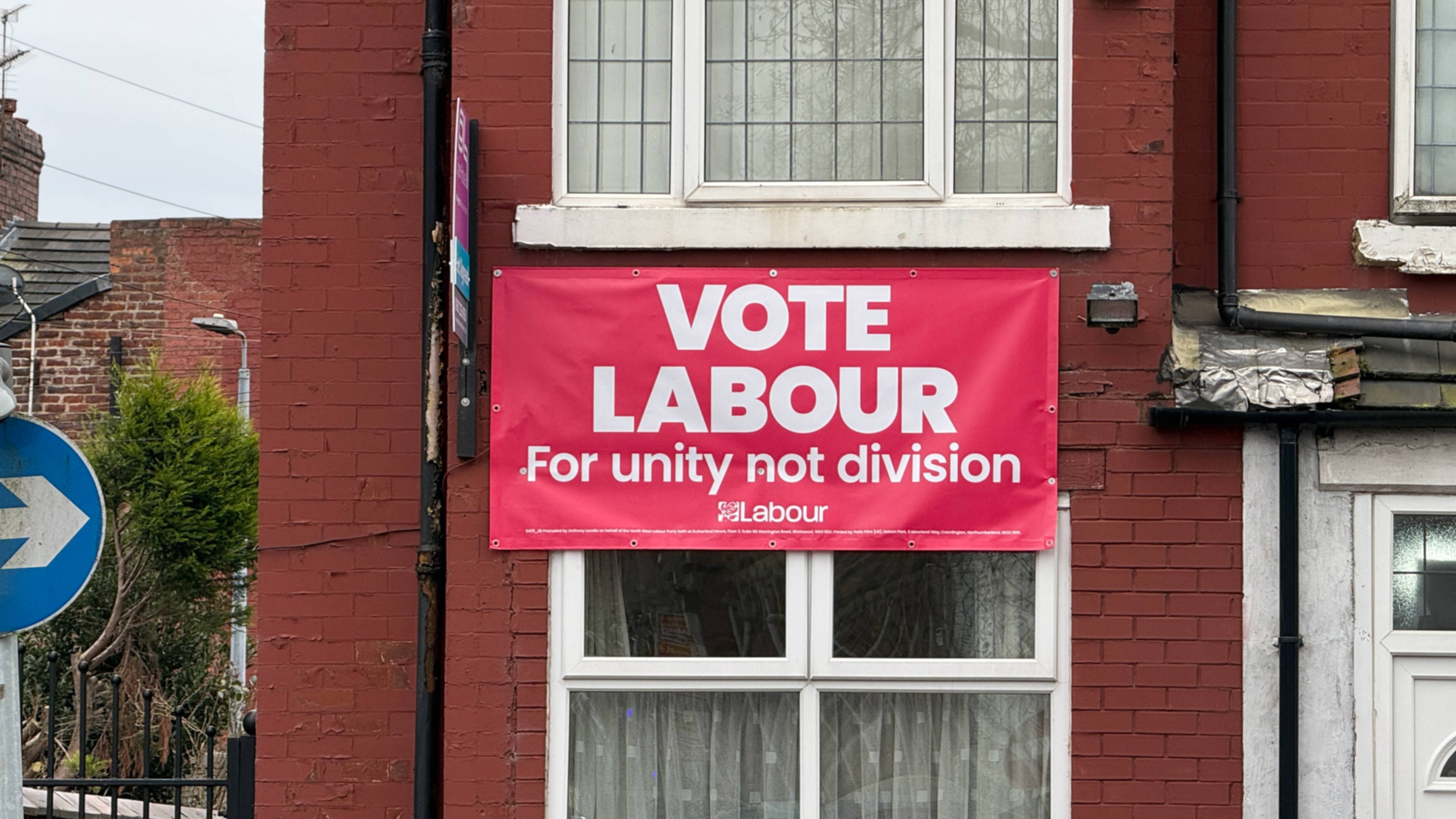 A Labour poster hung from a house in Gorton on 18 February. (Yaman Mohammed/ MEE)