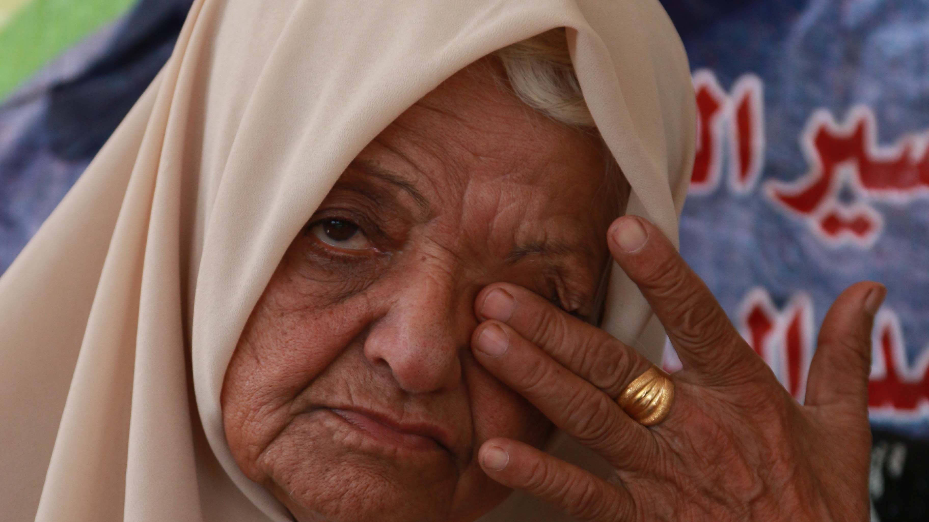 Subhia says she waited for her son by the window calling on his name while he was on the run, hoping her voice would guide him home. (Shatha Hanaysha/MEE)