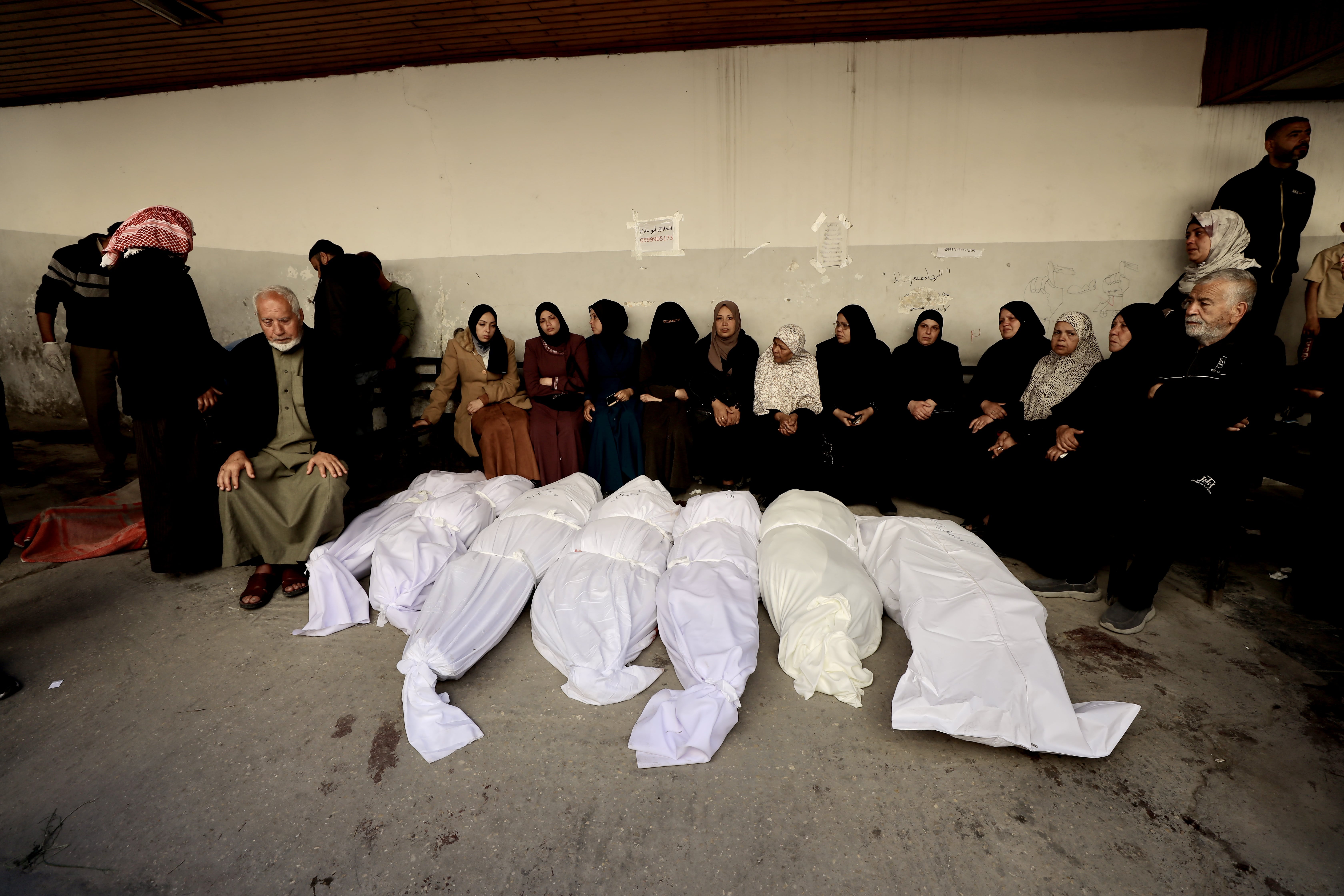 Mourners react to the bodies of Palestinians killed in Israeli strikes on Gaza Strip March 18, 2025. (Mohammed al-Najjar/AFP)