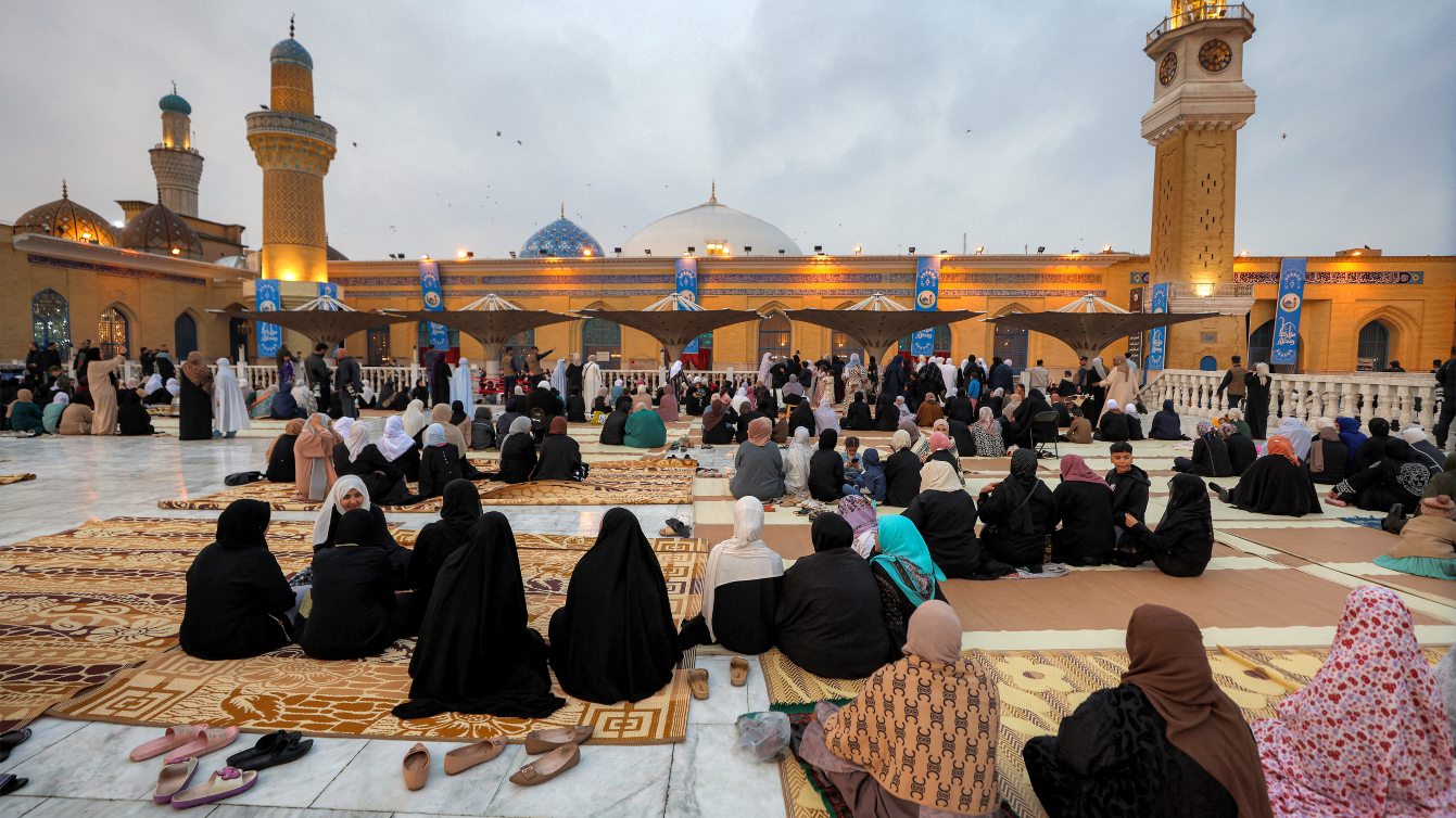 Worshippers attend prayers for Eid al-Fitr at Sheikh Abdul-Qadir al-Jilani Shrine in Baghdad on 20 March 2026. AHMAD AL-RUBAYE / AFP